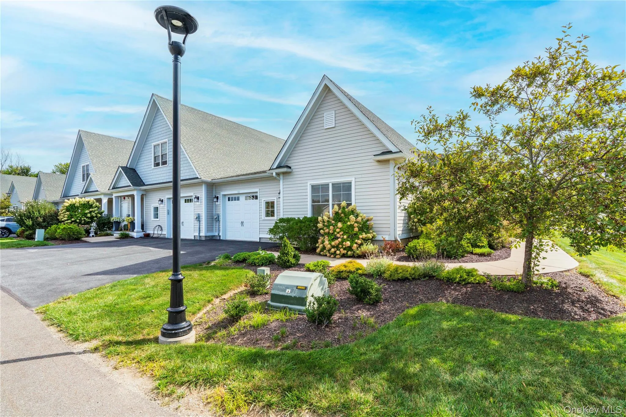 An Attached One Gar Garage & Paved Driveway An Attached One Gar Garage & Paved Driveway