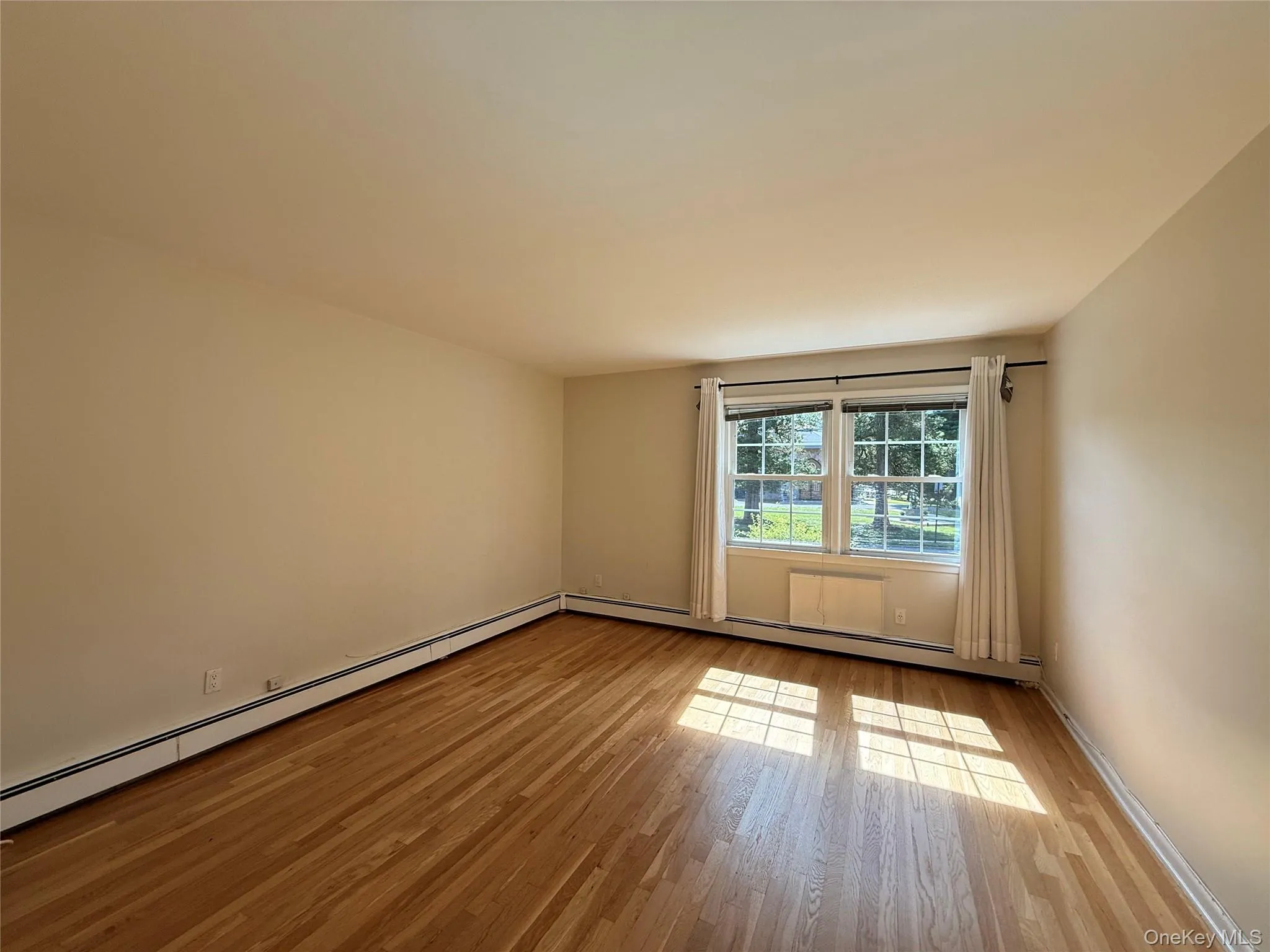 Spacious bedroom with refinished Hardwood flooring Spacious bedroom with refinished Hardwood flooring