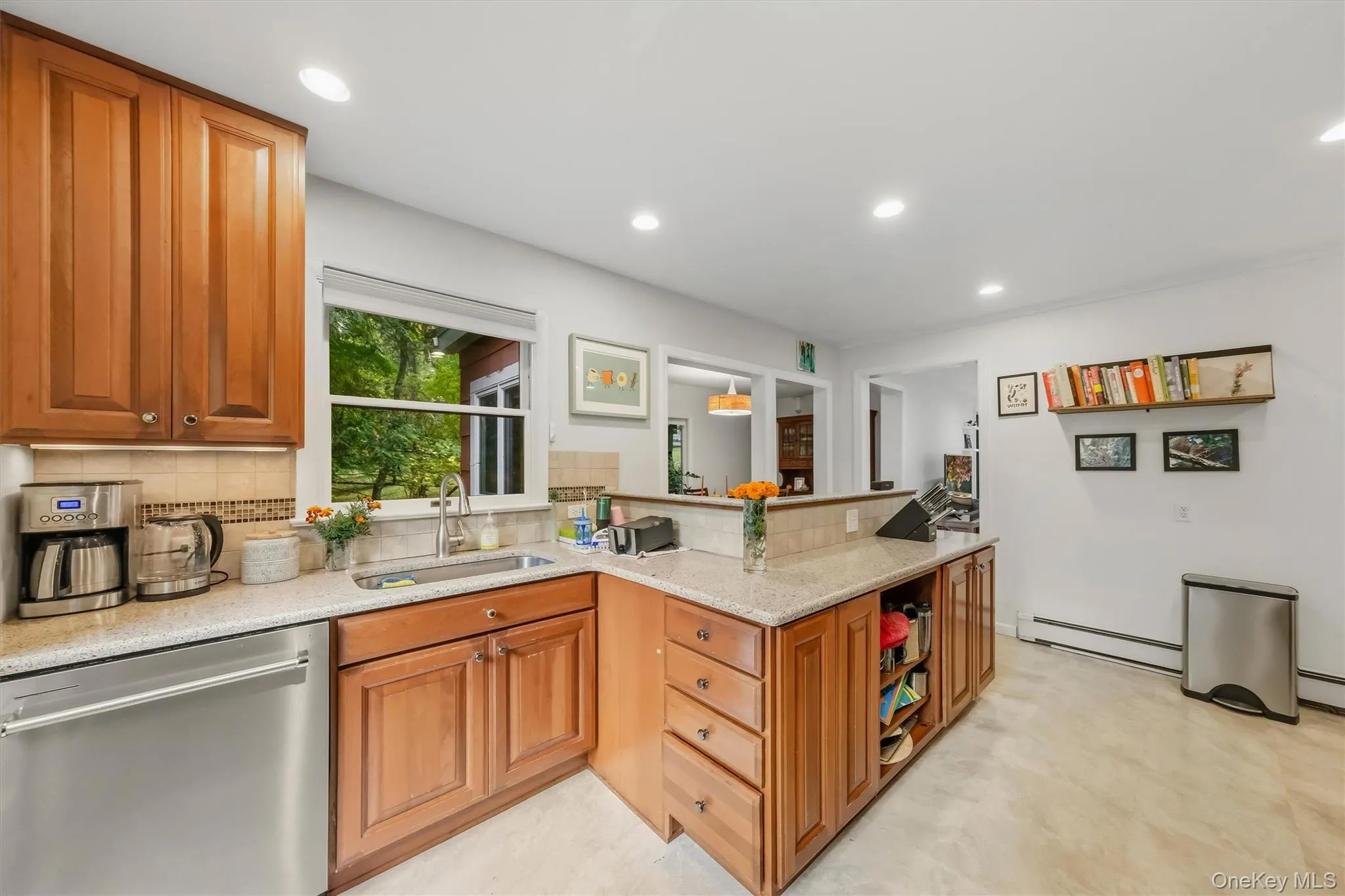 Kitchen view toward dining area. The chef isn't isolated from their guests, with this open design. Kitchen view toward dining area. The chef isn't isolated from their guests, with this open design.