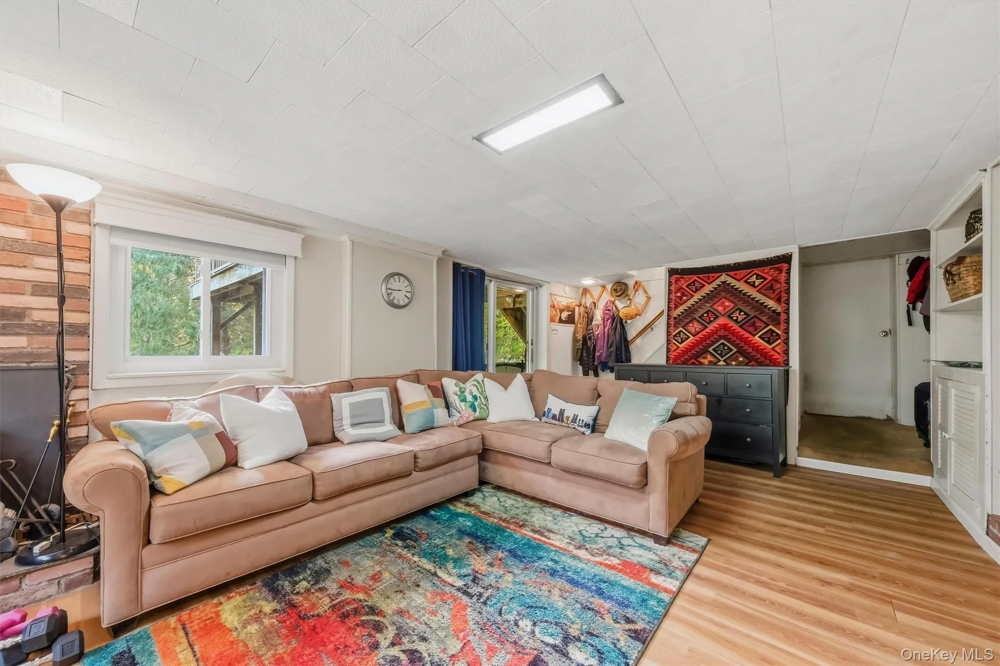 Finished basement with sliding glass doors to backyard. Finished basement with sliding glass doors to backyard.