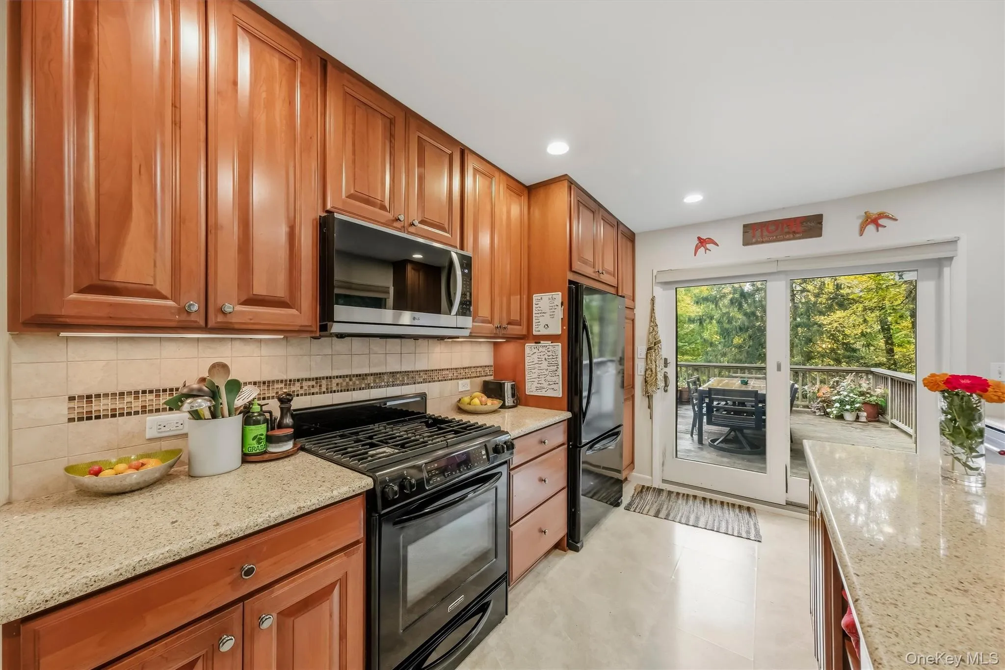 Sliding glass doors open to large deck. Sliding glass doors open to large deck.