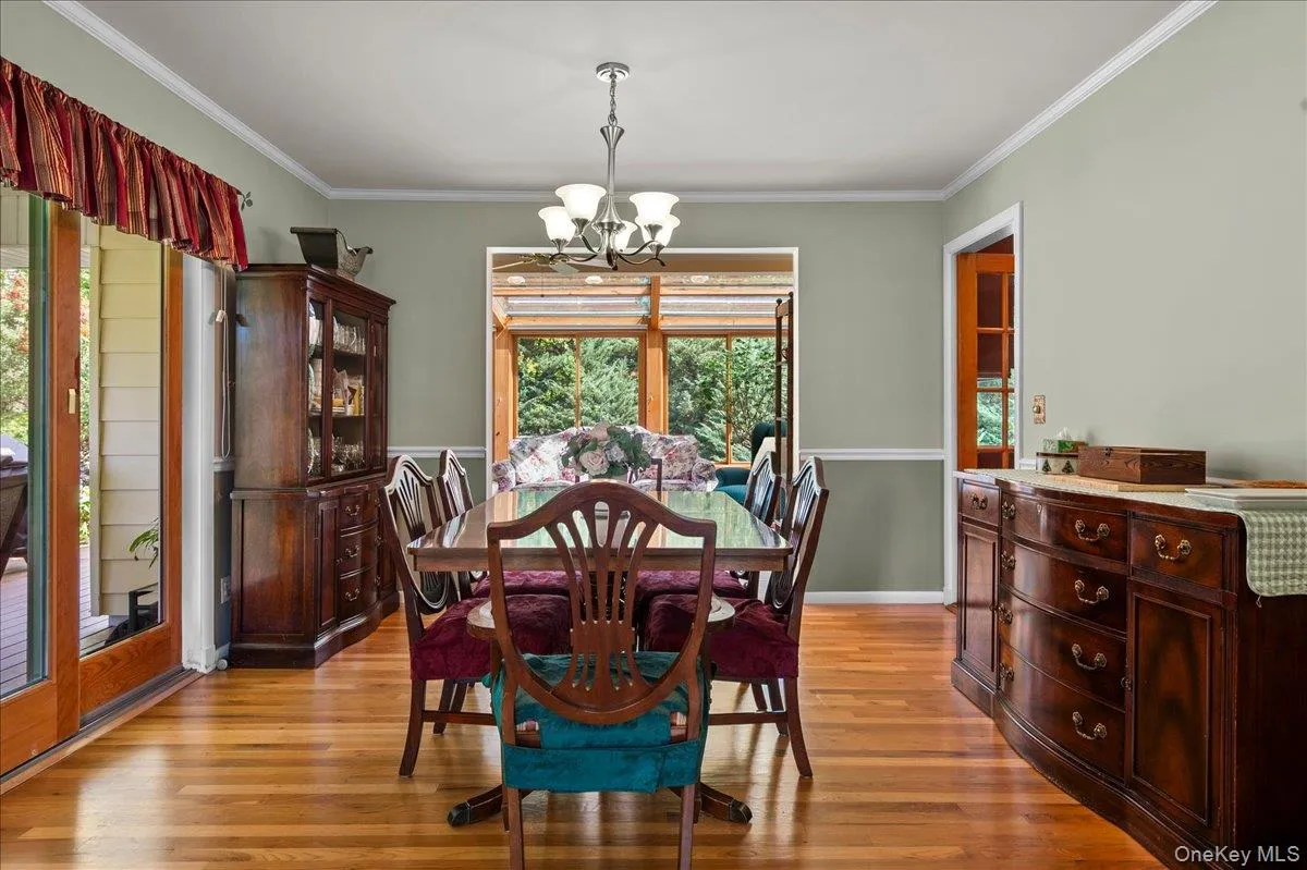 with oak floors and view into four seasons room with oak floors and view into four seasons room