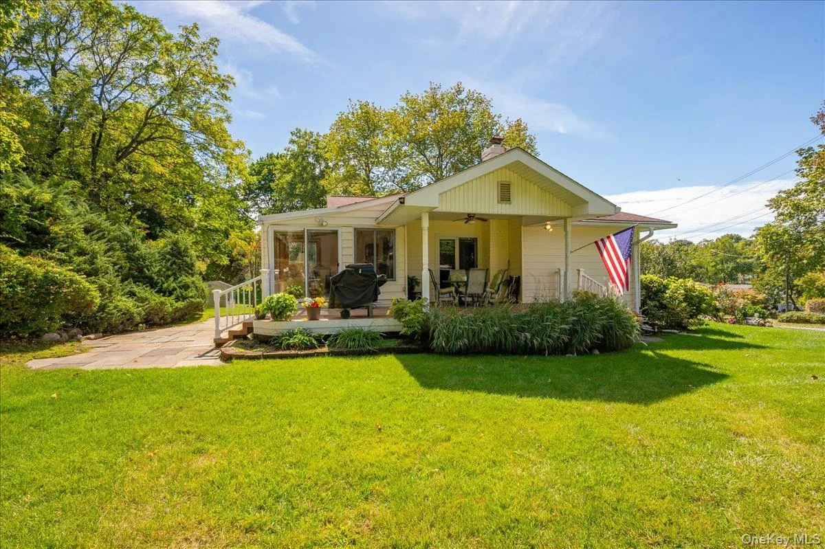 Covered porch with access from both dinning room and four seasons room. the perfect place to start or end the day Covered porch with access from both dinning room and four seasons room. the perfect place to start or end the day