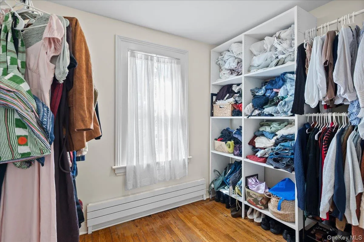 Primary bedroom adjacent walk in closet Primary bedroom adjacent walk in closet