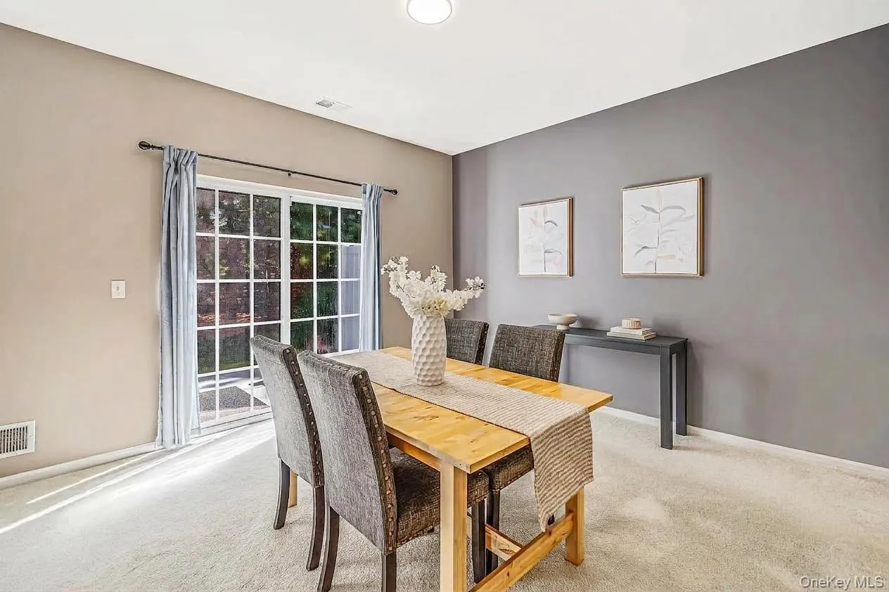 Dining room with sliding glass doors to rear yard Dining room with sliding glass doors to rear yard