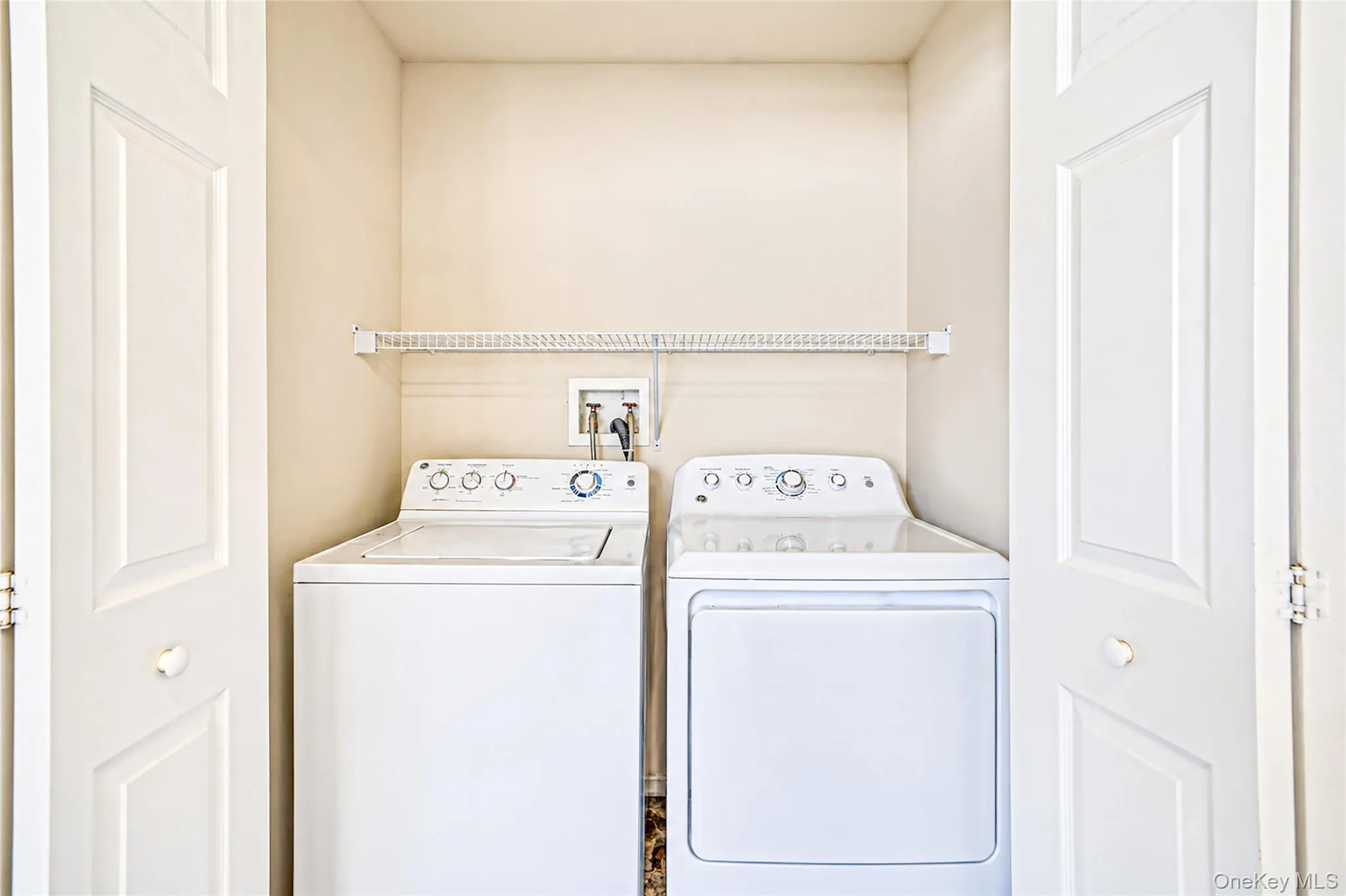 Second floor laundry area virtually decluttered Second floor laundry area virtually decluttered