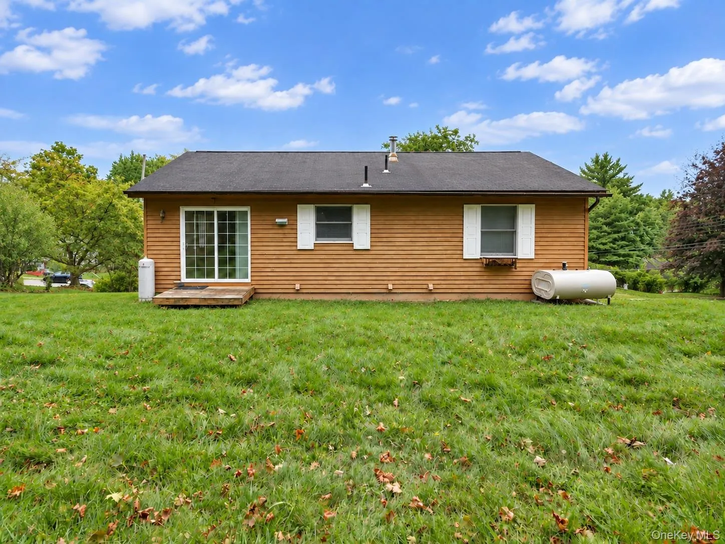 Expansive green lawn surrounding the property Expansive green lawn surrounding the property