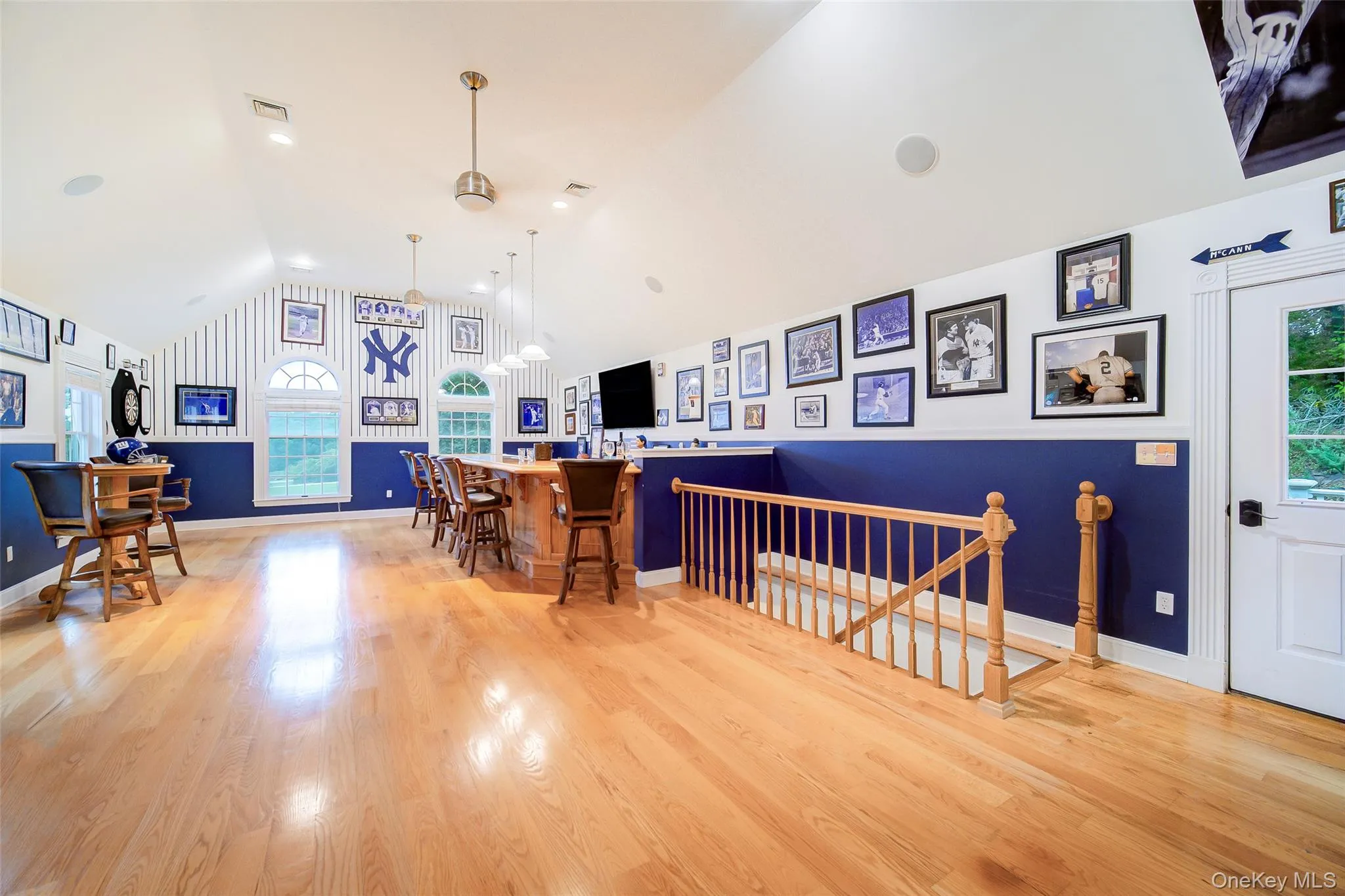 This spectacular Bonus Room is currently an enviable sports room. Radiant heated floors, high ceilings and a custom wood carved bar make this the perfect entertainment space. This spectacular Bonus Room is currently an enviable sports room. Radiant heated floors, high ceilings and a custom wood carved bar make this the perfect entertainment space.