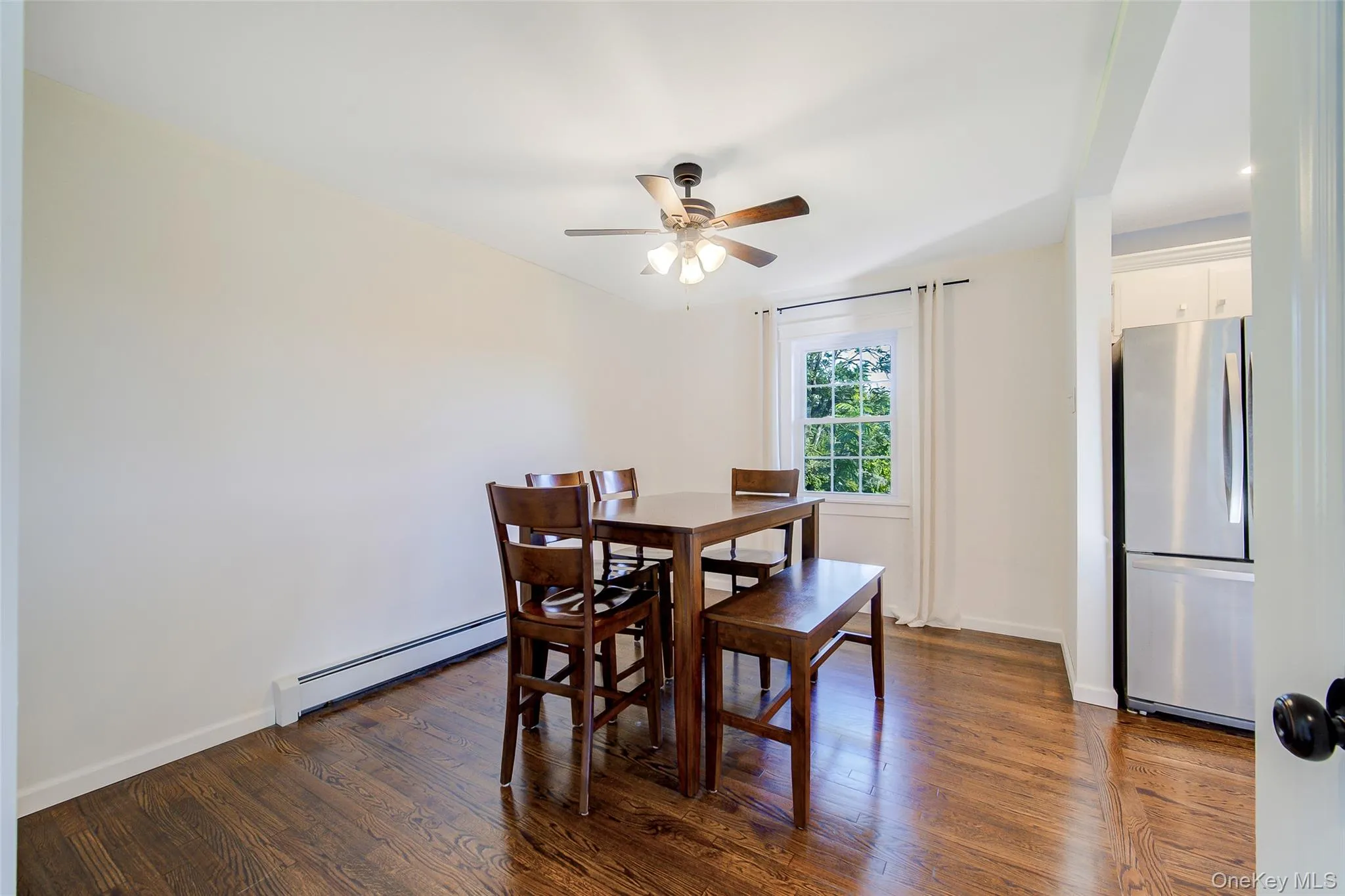 Large dining room area open to the kitchen has ceiling fan Large dining room area open to the kitchen has ceiling fan