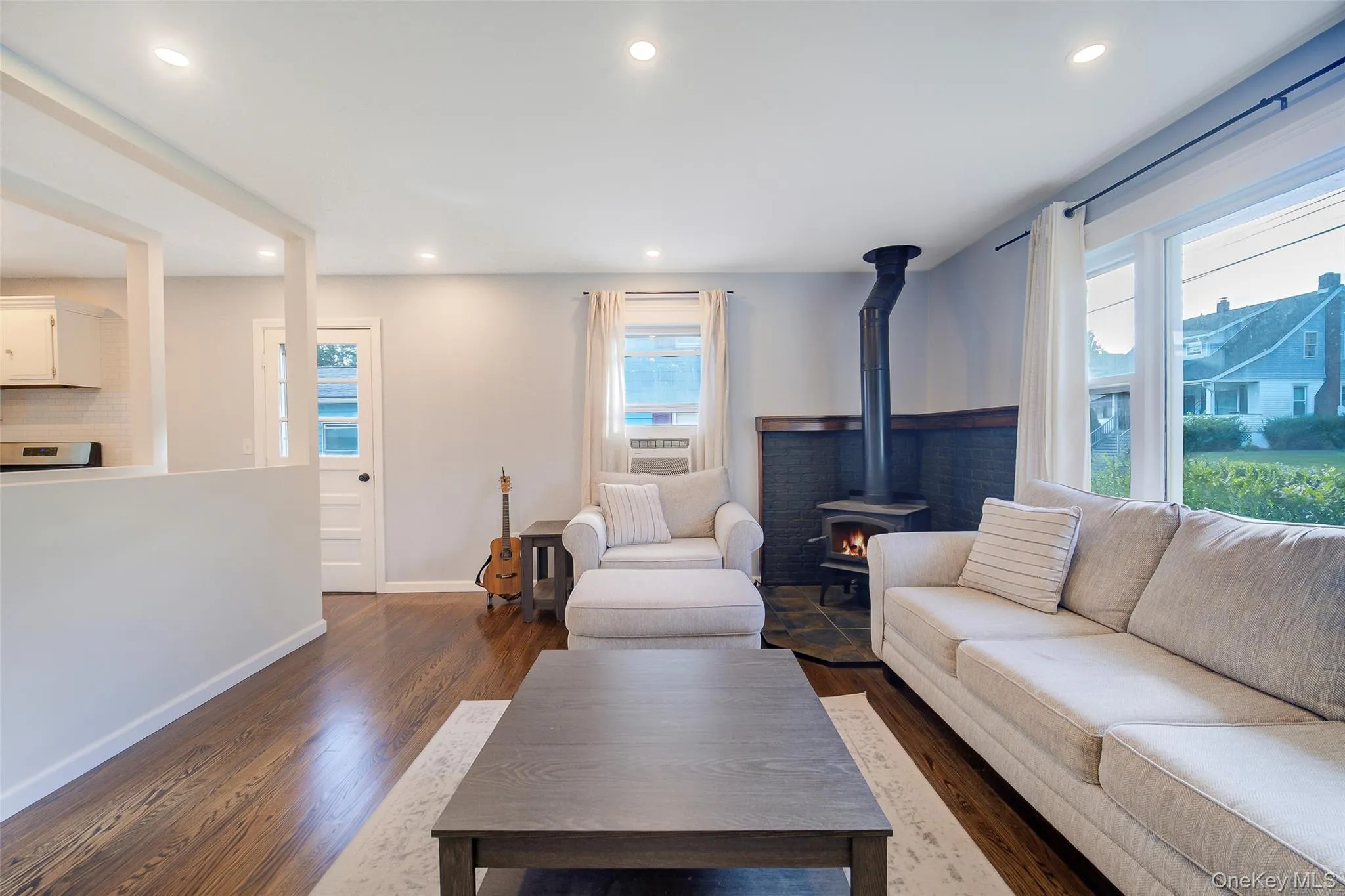 Living room is open to the kitchen. Living room is open to the kitchen.