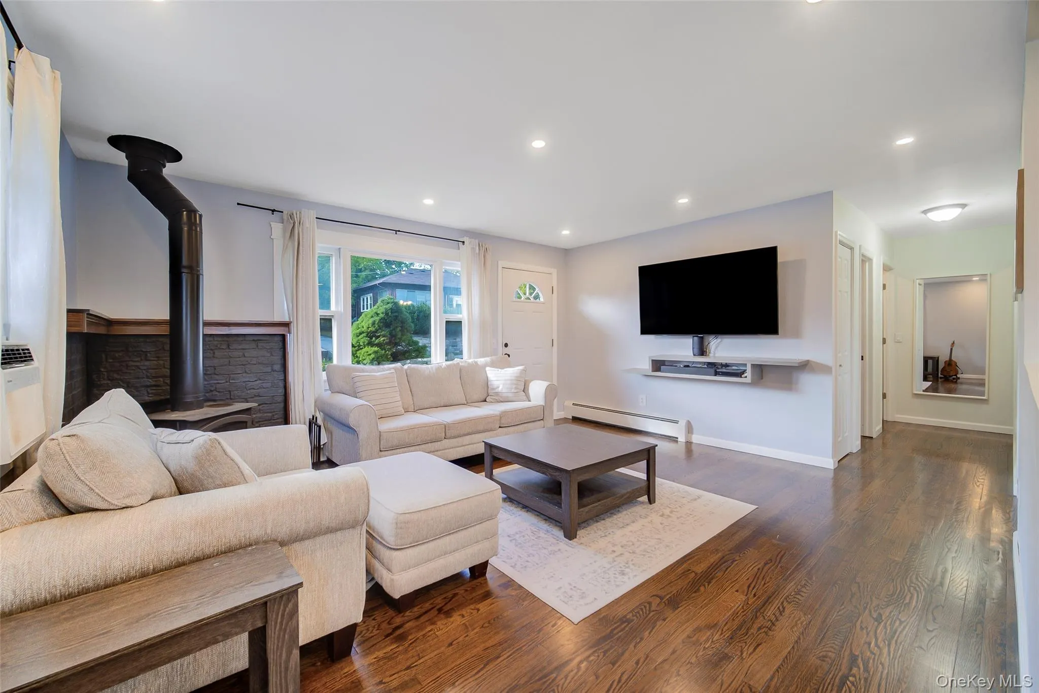 Large bay window in front provides natural light for this open concept floor plan Large bay window in front provides natural light for this open concept floor plan