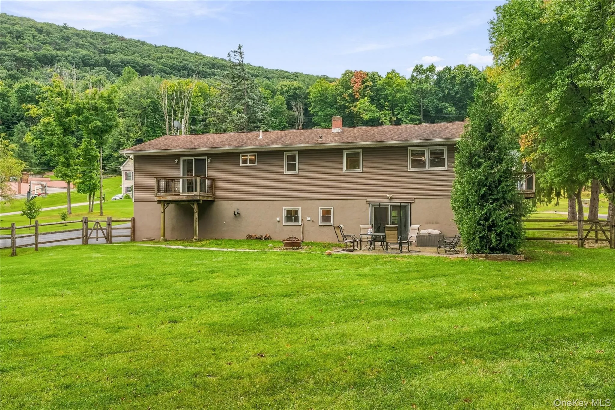 Expansive green lawn with mature trees Expansive green lawn with mature trees