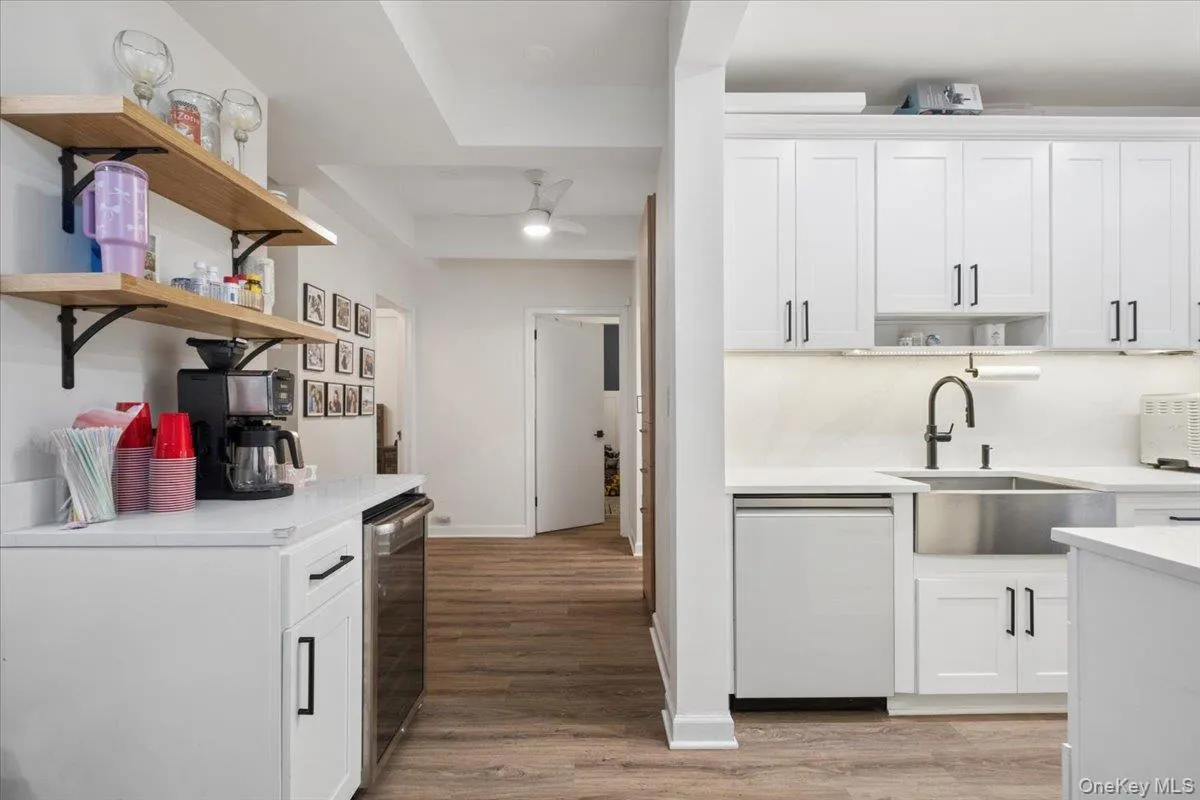 Beverage Center is on the left w/ Open Shelves and Built-in Wine Fridge Beverage Center is on the left w/ Open Shelves and Built-in Wine Fridge