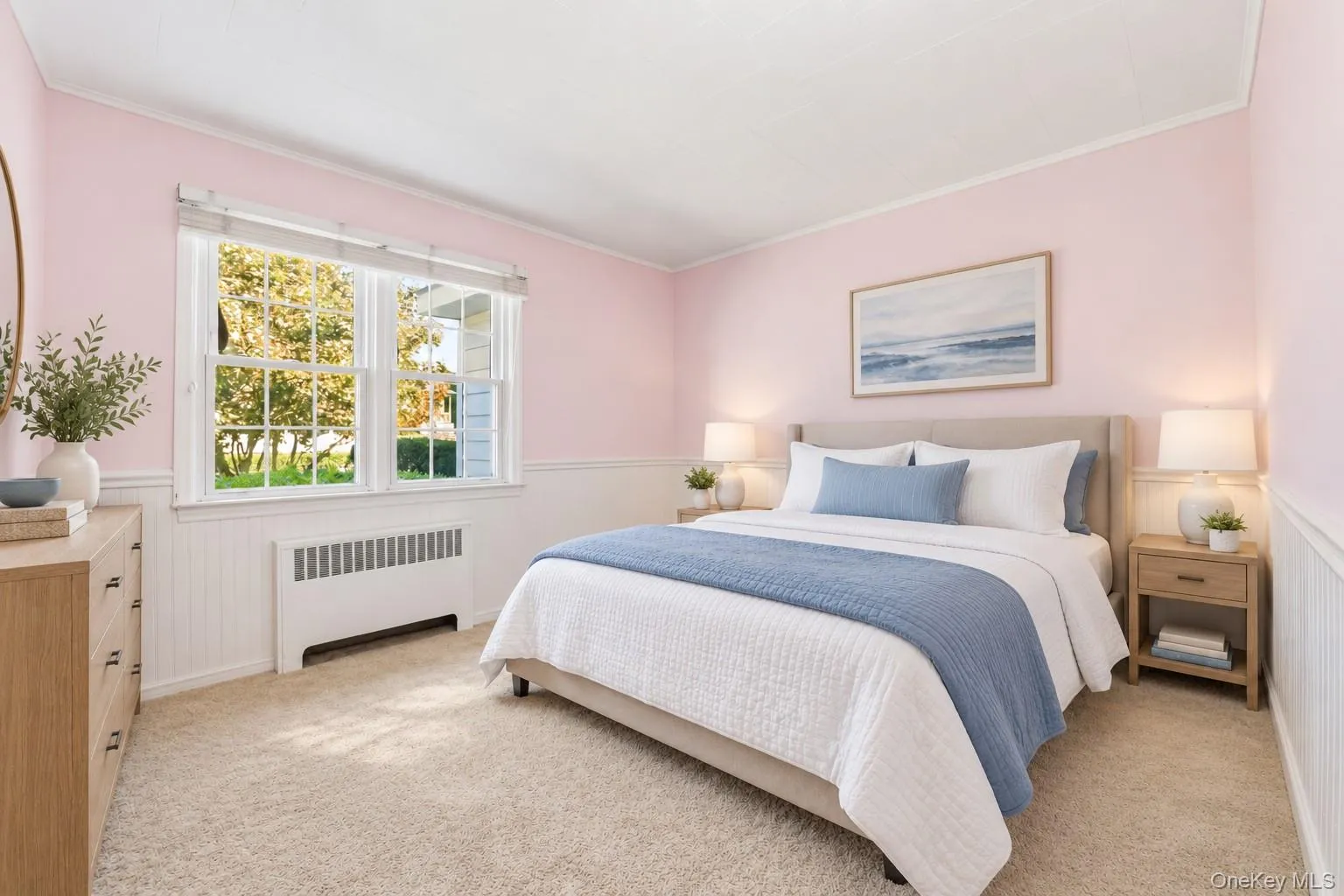 Carpeted flooring with painted walls, a window, and white wainscoting Carpeted flooring with painted walls, a window, and white wainscoting