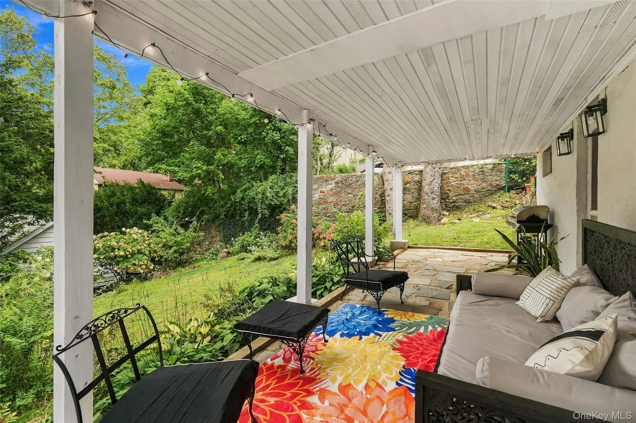 Lower Level - 2nd Patio and Lounge area overlooking the yard Lower Level - 2nd Patio and Lounge area overlooking the yard