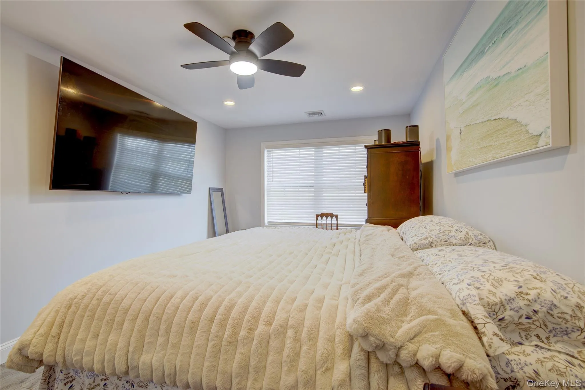 Bedroom with a ceiling fan and recessed lighting Bedroom with a ceiling fan and recessed lighting