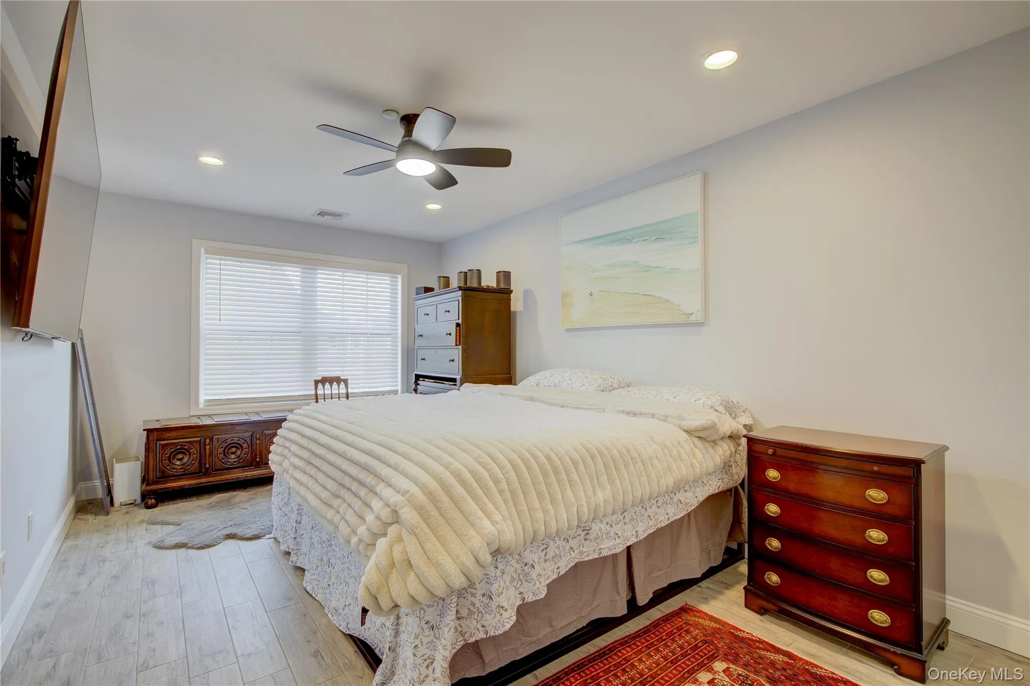 Bedroom featuring light wood-style floors, ceiling fan, and recessed lighting Bedroom featuring light wood-style floors, ceiling fan, and recessed lighting
