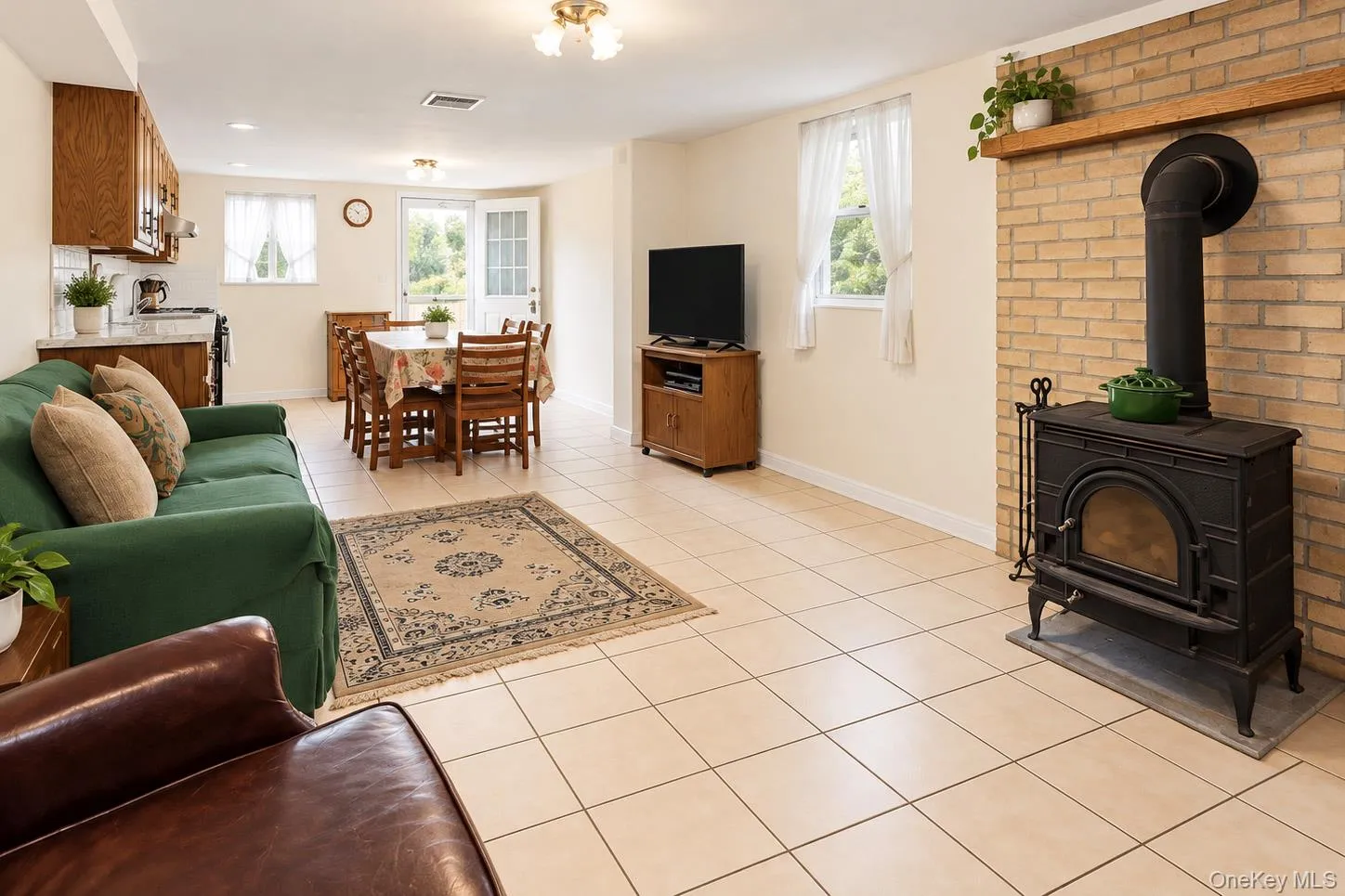 Open-concept living space with tile flooring throughout Open-concept living space with tile flooring throughout