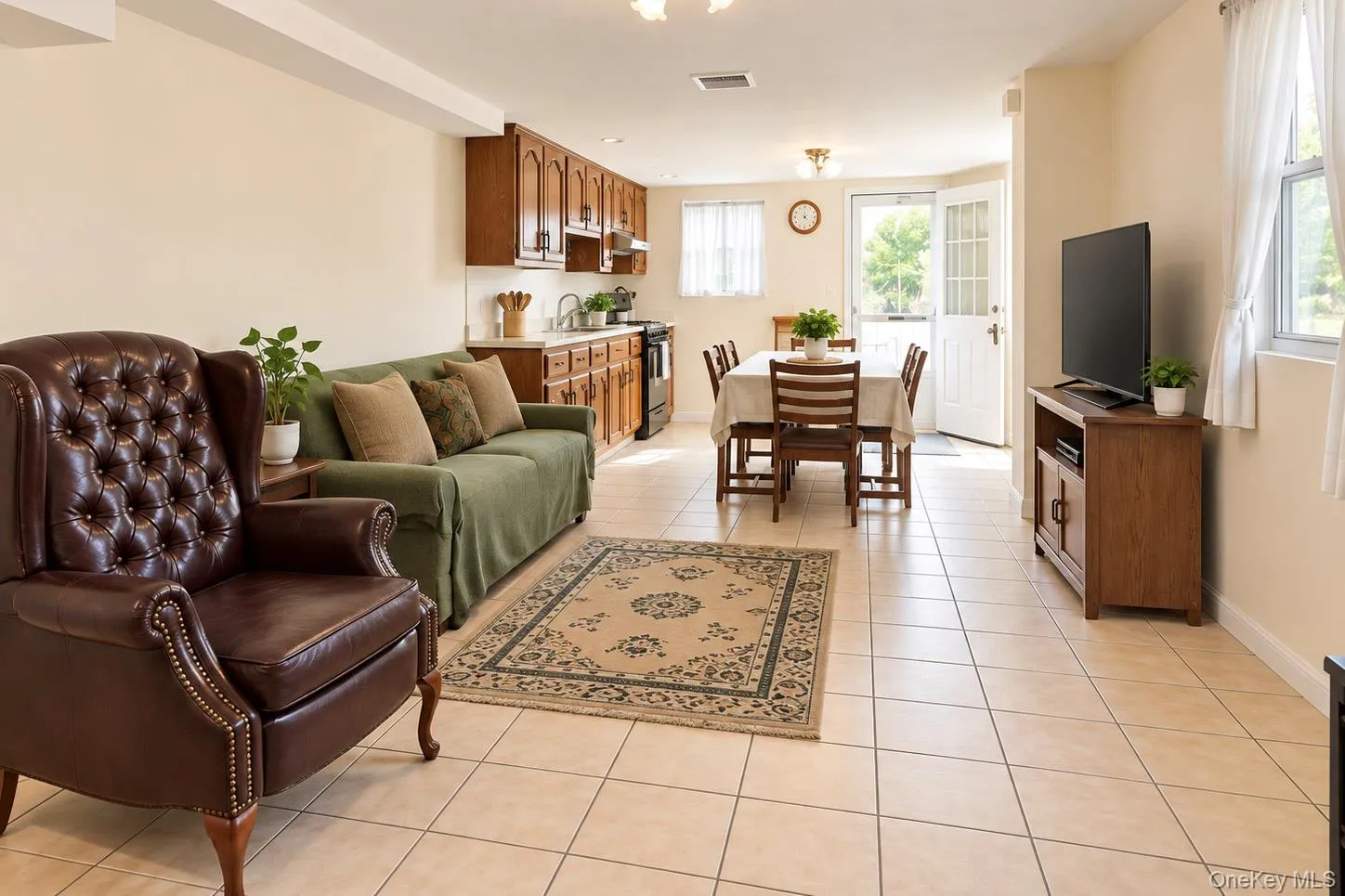 Open-concept living space with tile flooring throughout Open-concept living space with tile flooring throughout