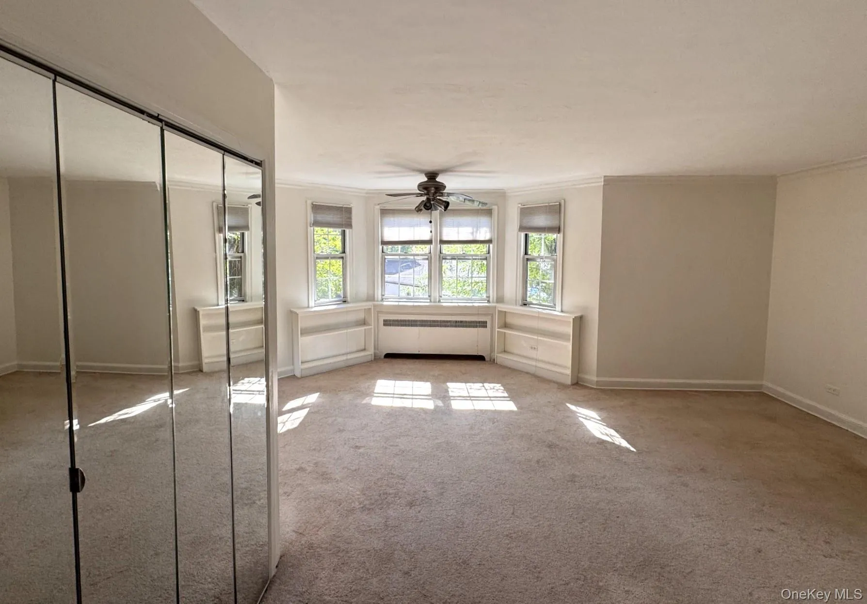 Spacious room with lots of windows and closet. Spacious room with lots of windows and closet.