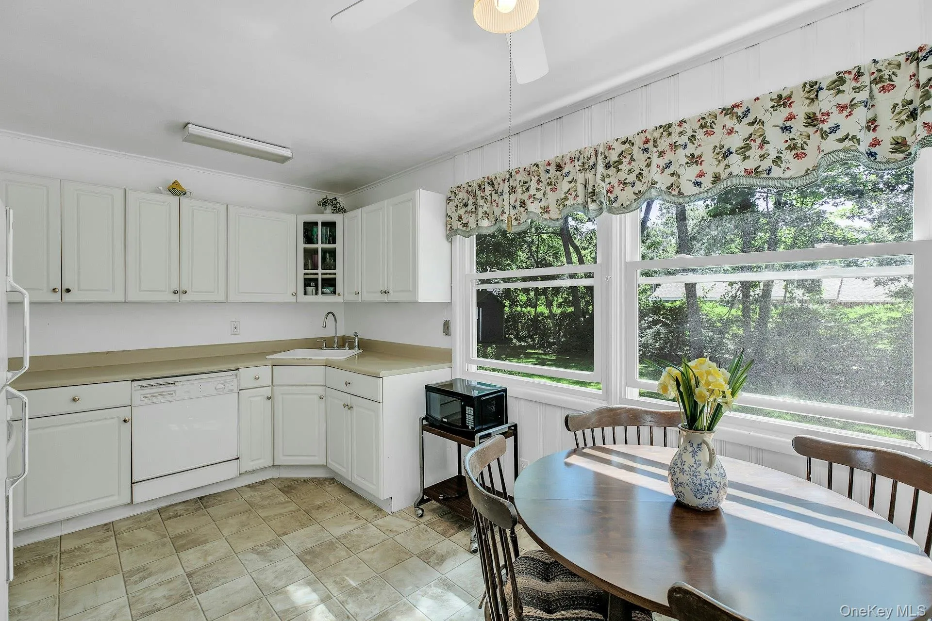 White cabinetry with brushed nickel hardware White cabinetry with brushed nickel hardware