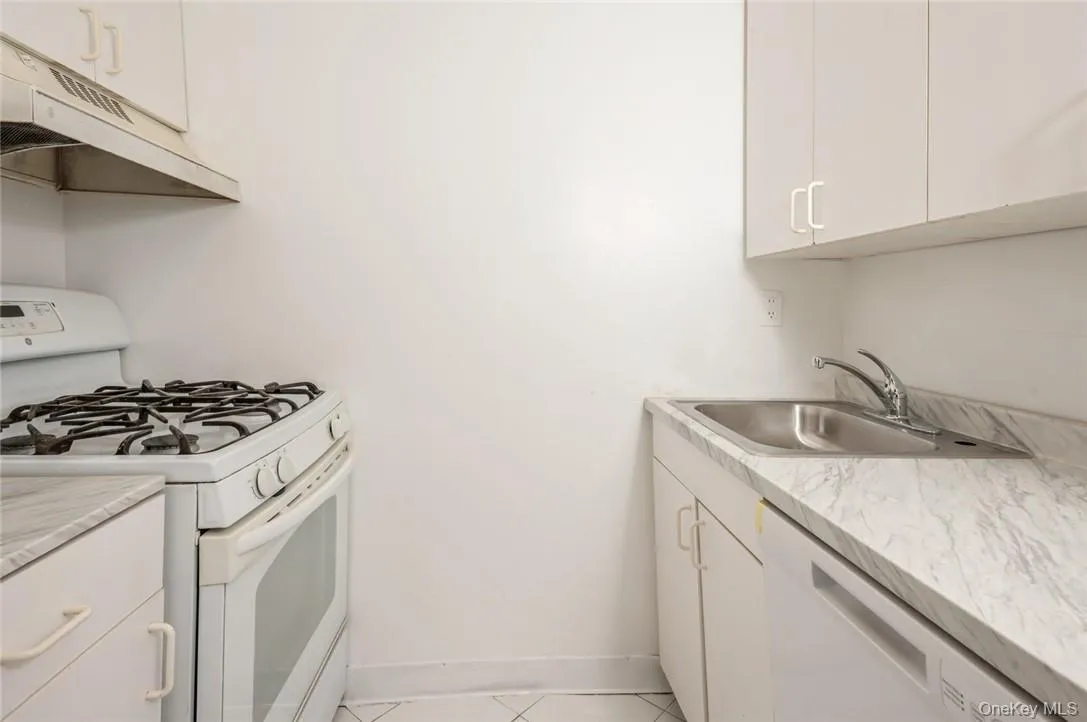 Large kitchen featuring recently installed new dishwasher, counter top and sink Large kitchen featuring recently installed new dishwasher, counter top and sink
