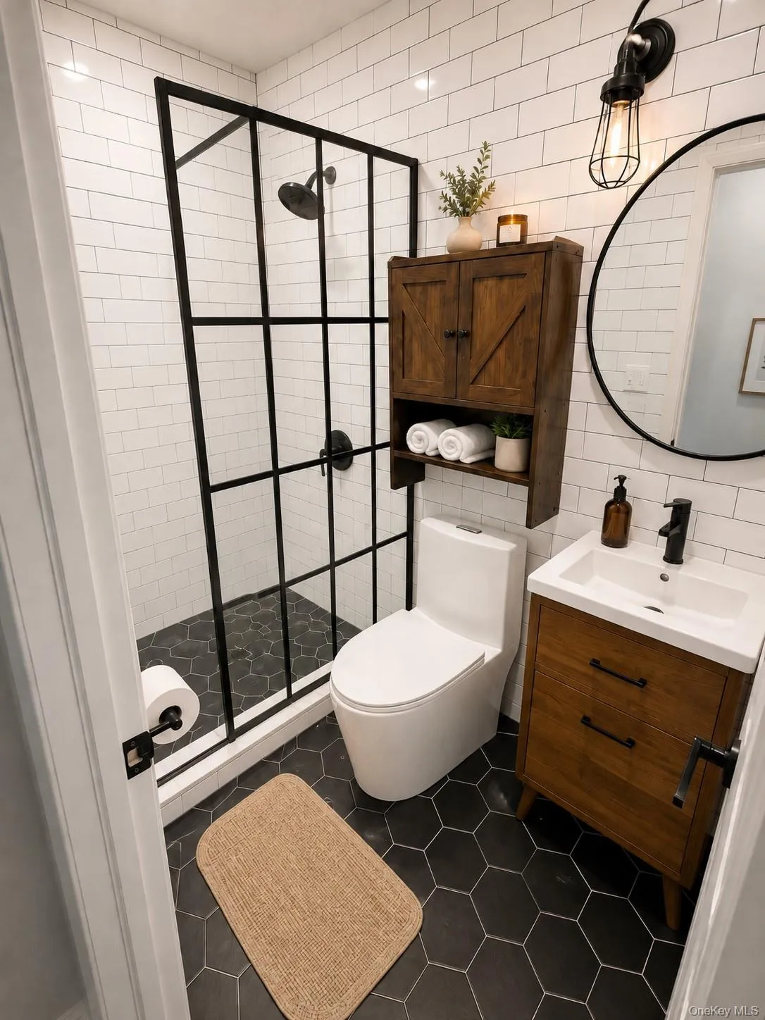 Black hexagon tile flooring with white subway tile walls Black hexagon tile flooring with white subway tile walls