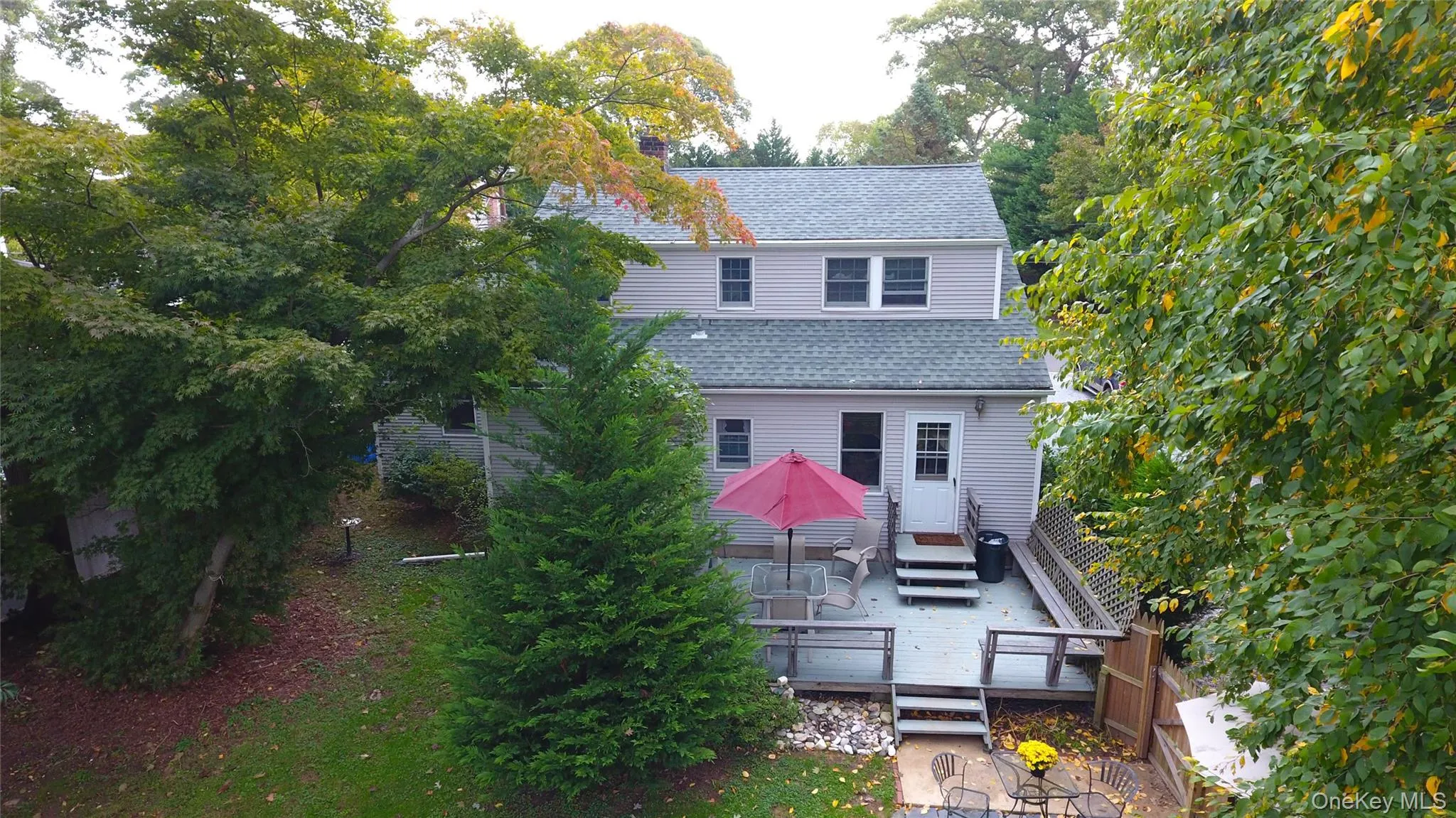 Aerial View of the back of the house and the deck Aerial View of the back of the house and the deck