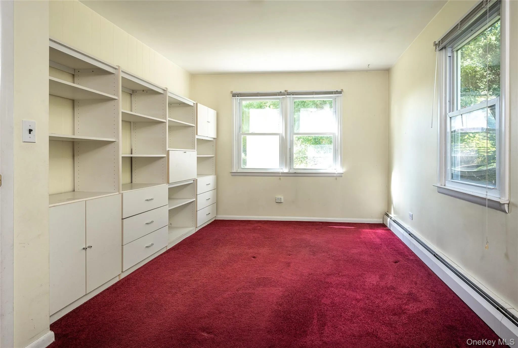 Bedroom w/built-in shelving Bedroom w/built-in shelving