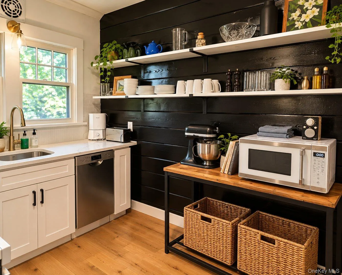 Virtually Staged. Kitchen with light hardwood / wood-style floors, white cabinetry, and stainless steel dishwasher Virtually Staged. Kitchen with light hardwood / wood-style floors, white cabinetry, and stainless steel dishwasher