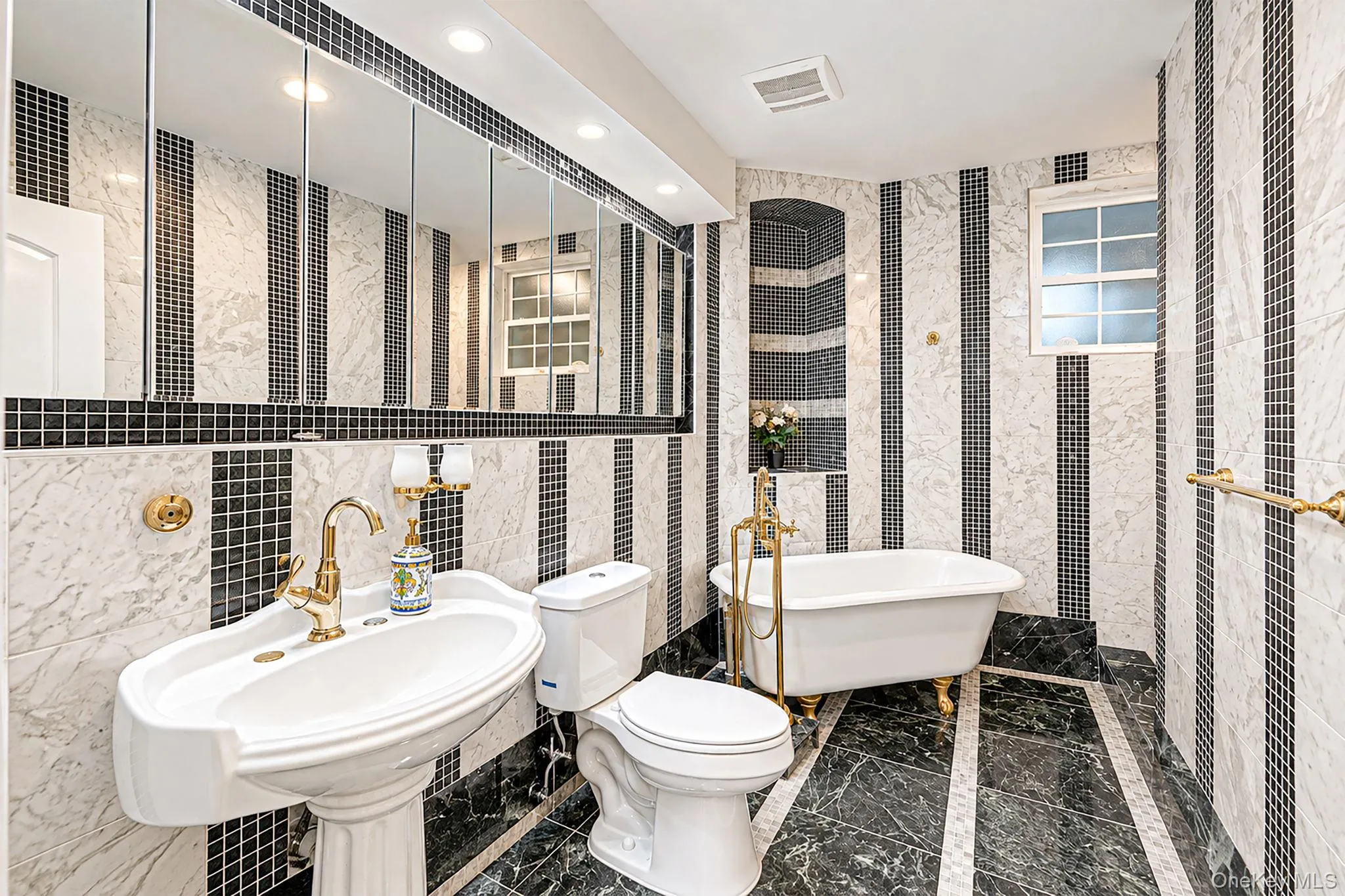 Bathroom One - ground level - pedestal sink, tub and stall shower Bathroom One - ground level - pedestal sink, tub and stall shower