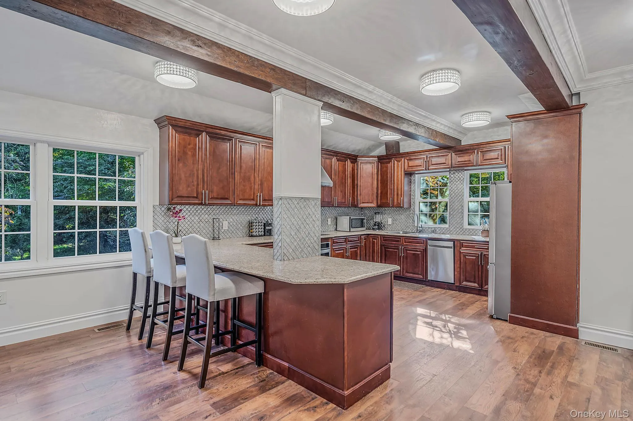 Updated Kitchen with custom wood cabintrym breakfast bar and dining area Updated Kitchen with custom wood cabintrym breakfast bar and dining area