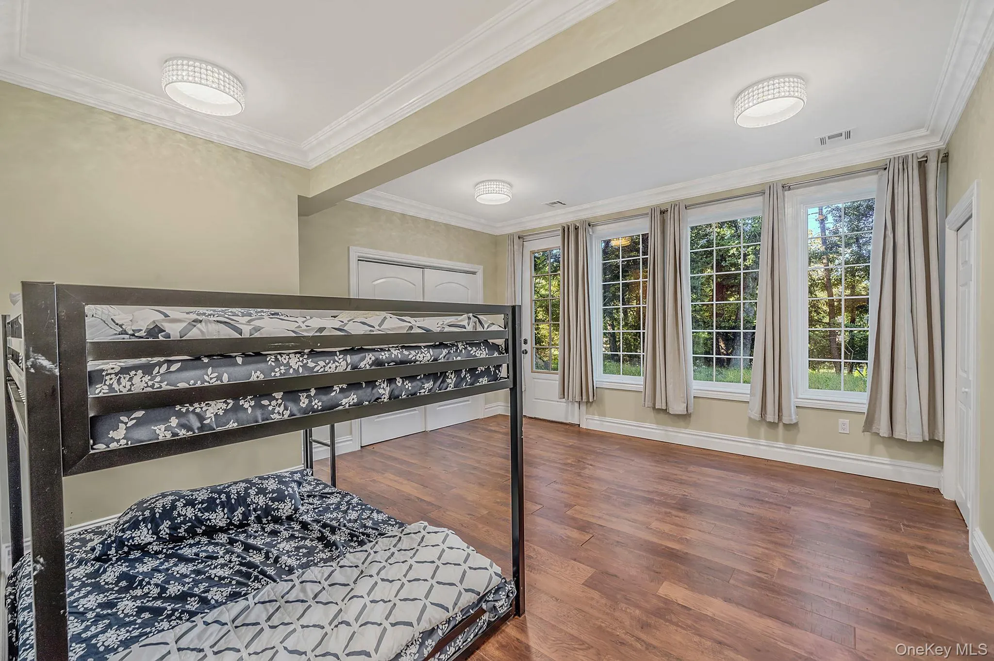Bdrm One - Ground level bedroom/office with closets and seprate exterior entry Bdrm One - Ground level bedroom/office with closets and seprate exterior entry