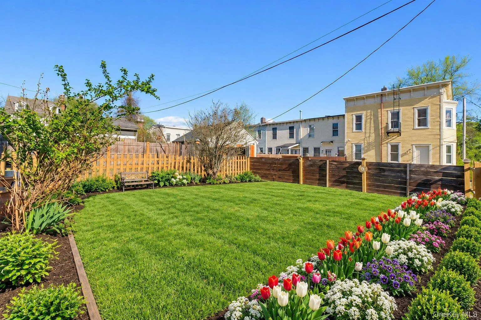 Virtually Staged Furniture. Spacious fenced backyard with a level lawn area, perimeter landscaping, mature plantings, and room for outdoor enjoyment. Virtually Staged Furniture. Spacious fenced backyard with a level lawn area, perimeter landscaping, mature plantings, and room for outdoor enjoyment.