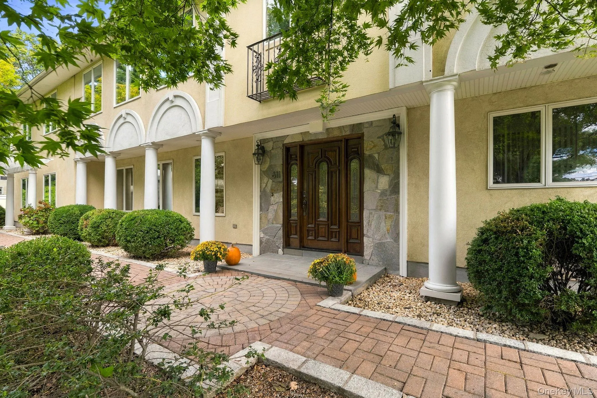 A striking stucco residence defined by graceful arches, elegant columns and unmistakable presence. A striking stucco residence defined by graceful arches, elegant columns and unmistakable presence.