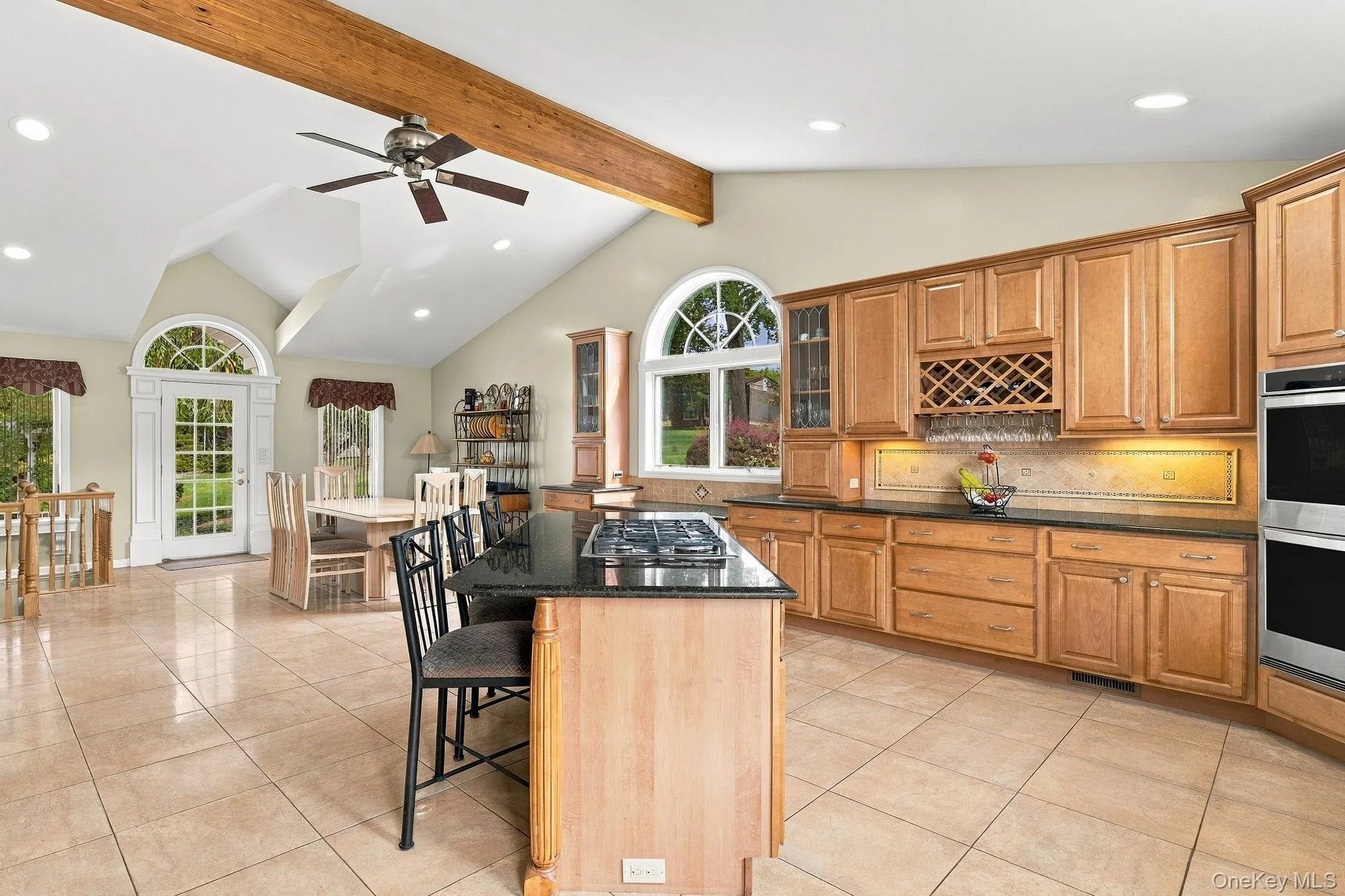 Expansive granite surfaces, custom cabinetry and a substantial center island create a kitchen of exceptional scale. Expansive granite surfaces, custom cabinetry and a substantial center island create a kitchen of exceptional scale.