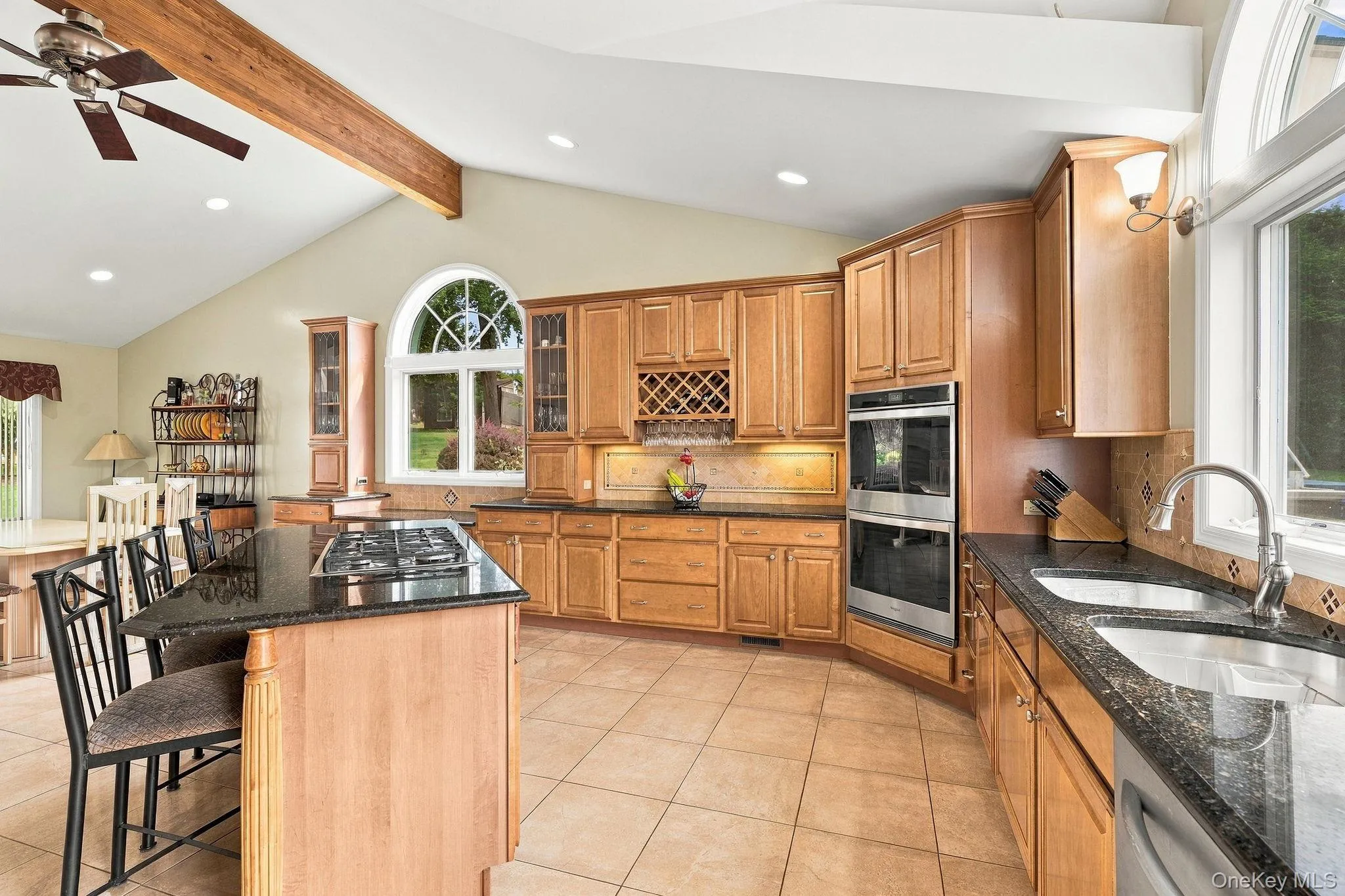 Bathed in natural light and overlooking the grounds, this kitchen commands attention. Bathed in natural light and overlooking the grounds, this kitchen commands attention.
