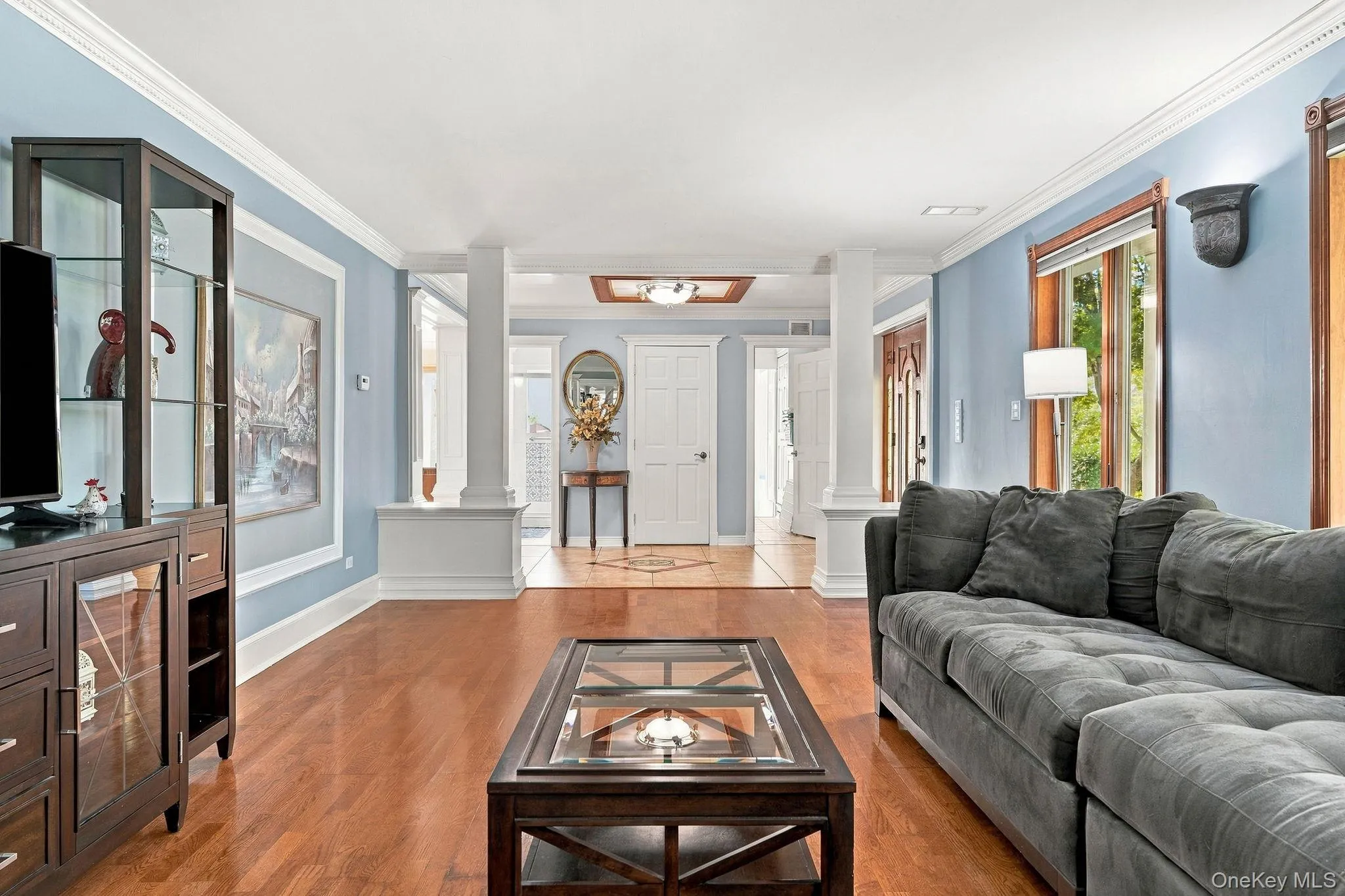 An impressive living room anchored by a handsome fireplace and abundant natural light. An impressive living room anchored by a handsome fireplace and abundant natural light.