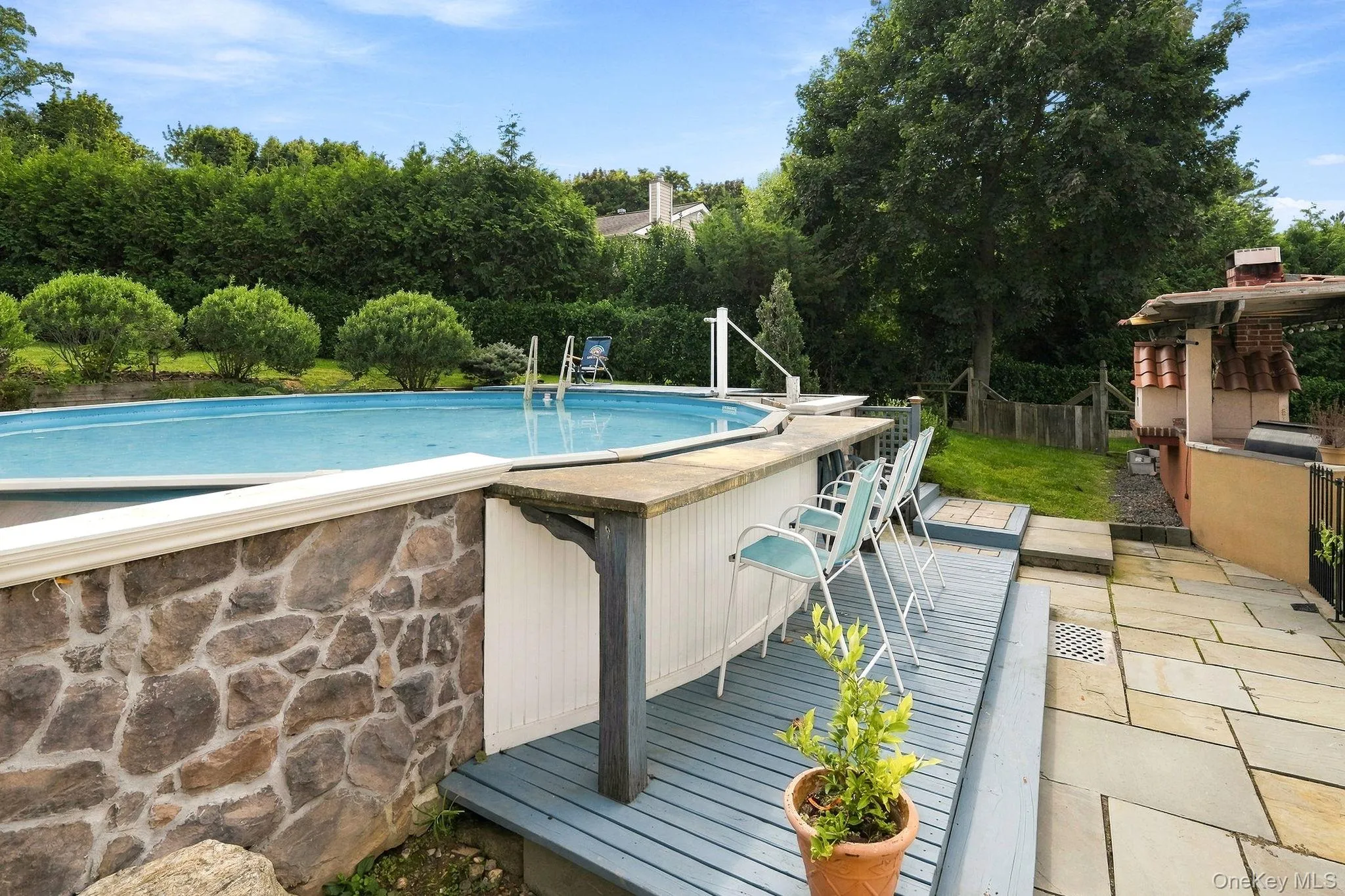 A private pool retreat surrounded by mature landscaping. A private pool retreat surrounded by mature landscaping.