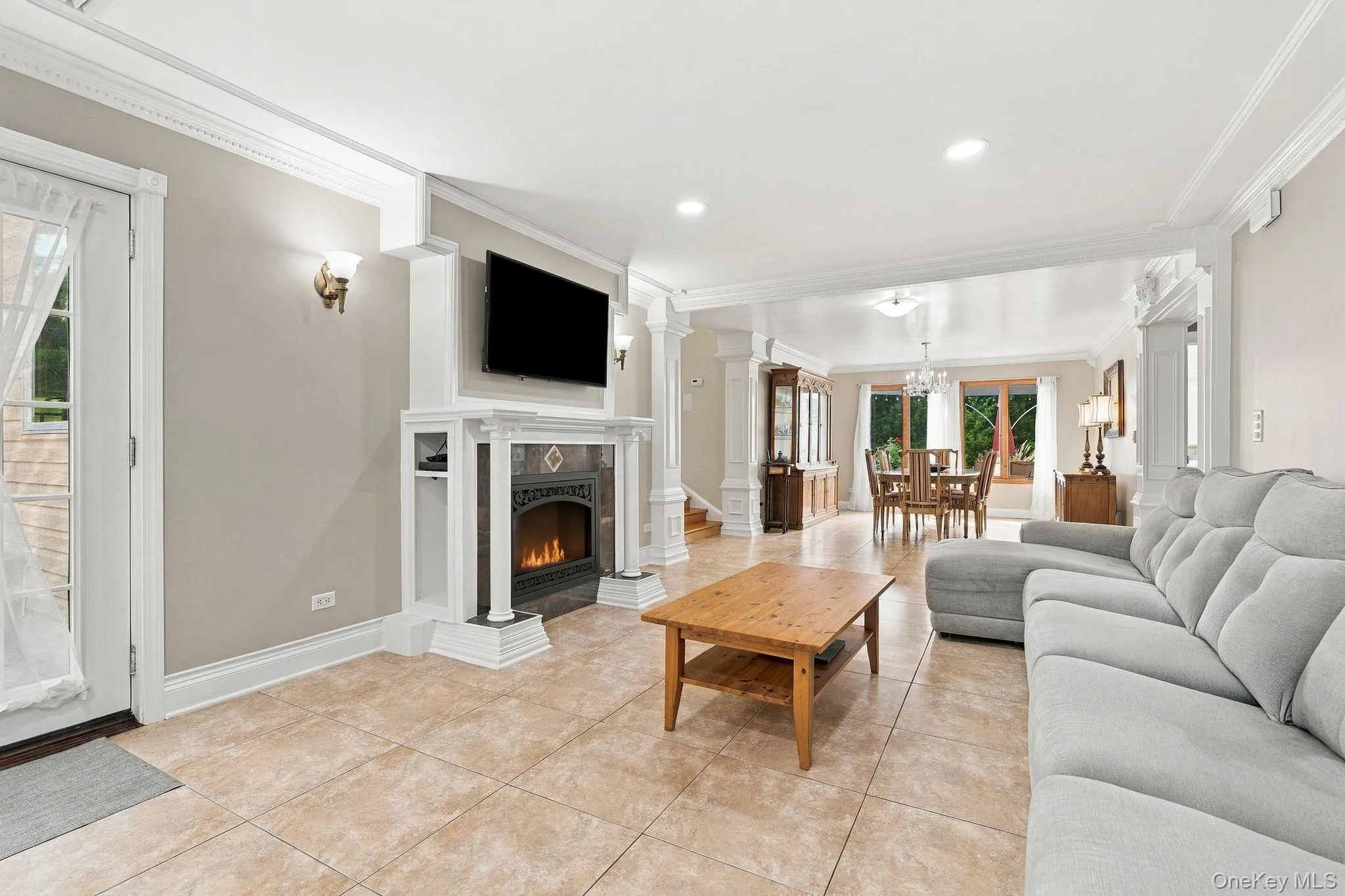 French doors extend the living space effortlessly to the private grounds. French doors extend the living space effortlessly to the private grounds.