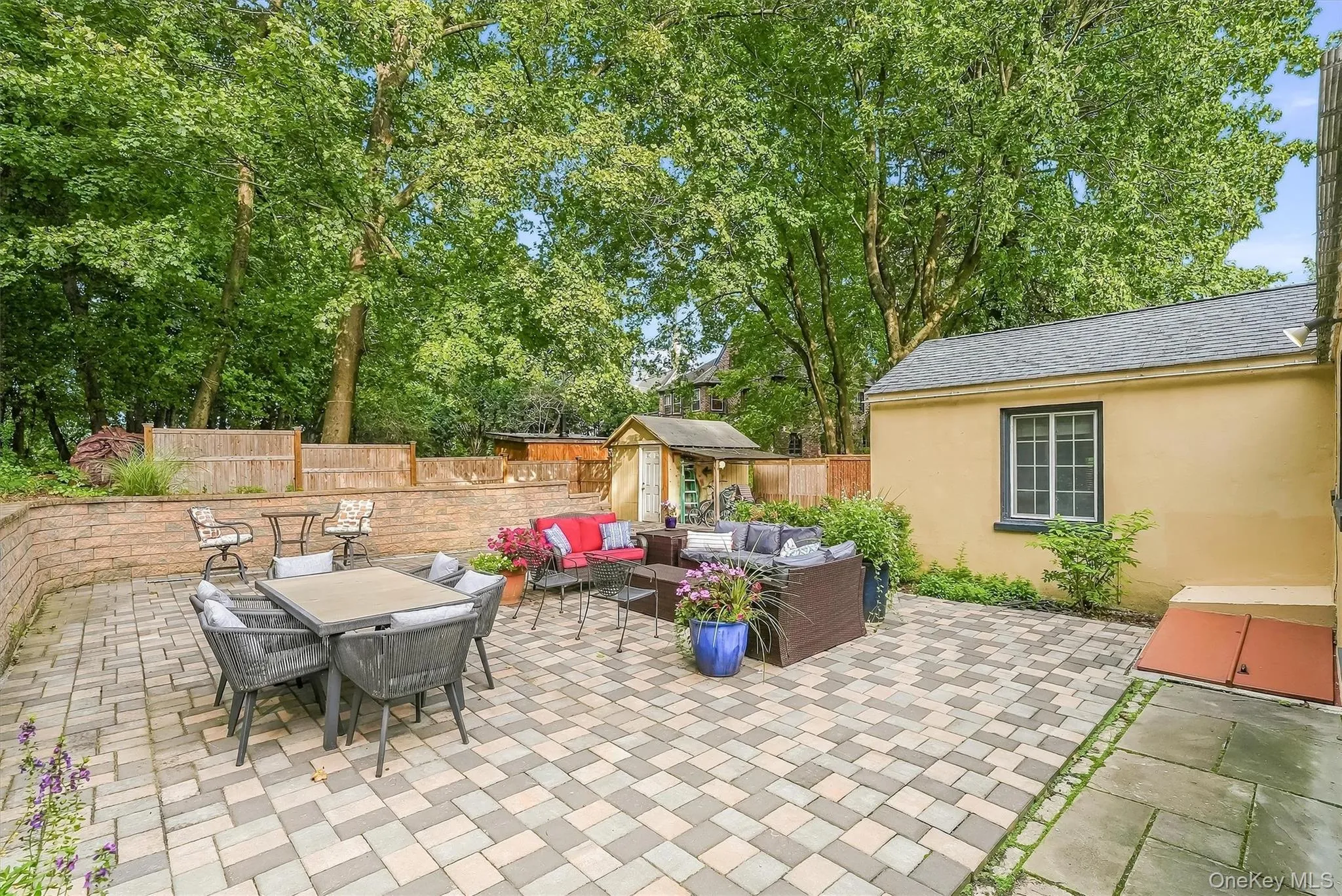 The back of the home is a custom, oversized patio offering maintenance free living. The back of the home is a custom, oversized patio offering maintenance free living.