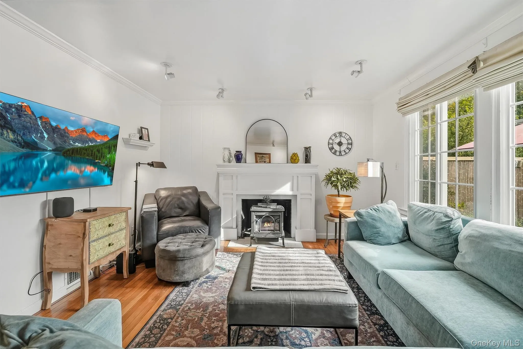 The perfect spot to unwind and relax! The custom mantle accents the gas stove. The perfect spot to unwind and relax! The custom mantle accents the gas stove.