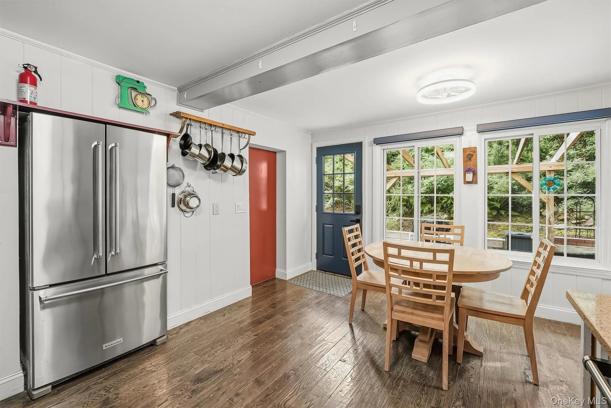The kitchen overlooks the private backyard with a spacious custom patio. The kitchen overlooks the private backyard with a spacious custom patio.
