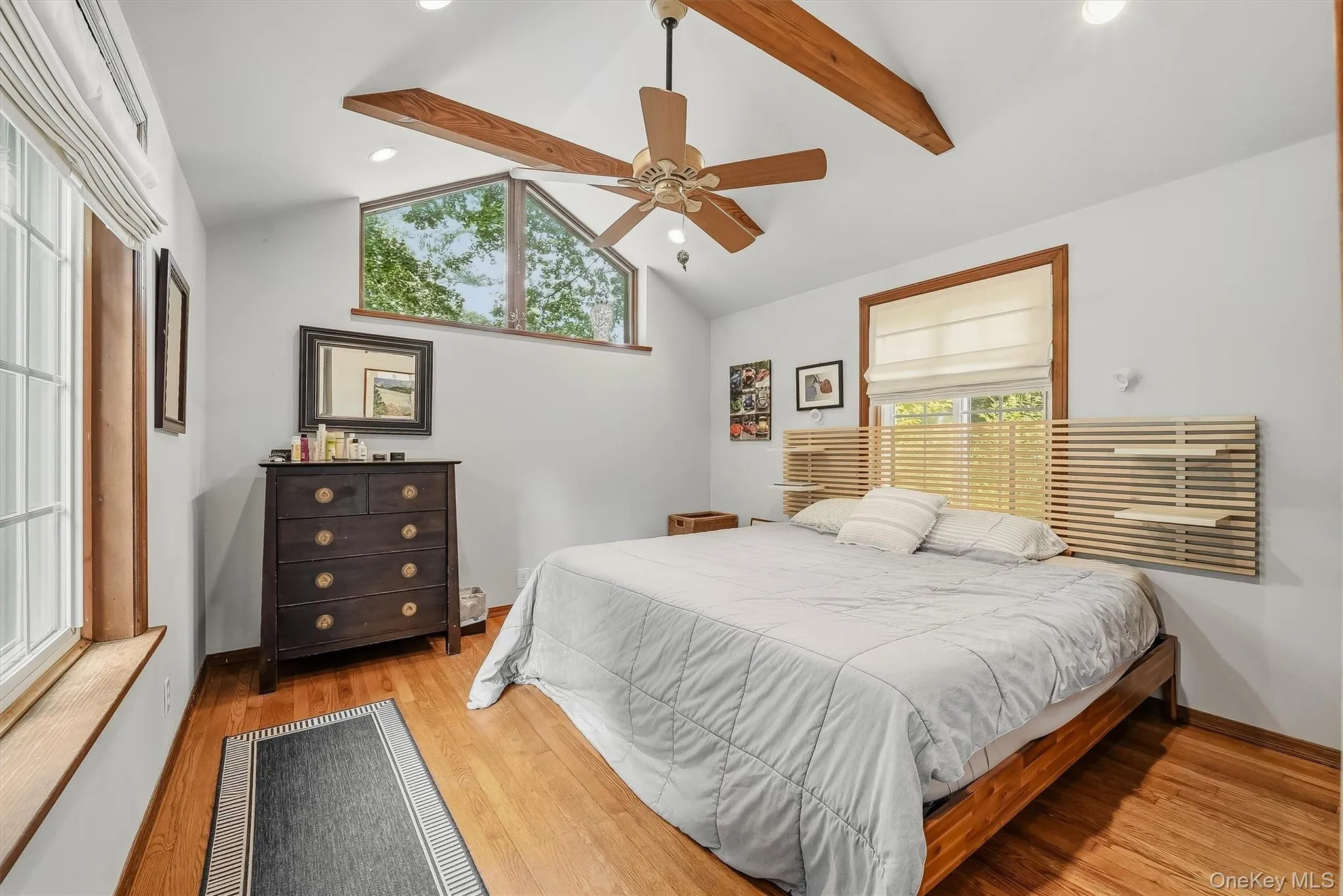 The oversized primary bedroom features custom windows, cathedral ceilings and is large enough for a king size bed. The oversized primary bedroom features custom windows, cathedral ceilings and is large enough for a king size bed.