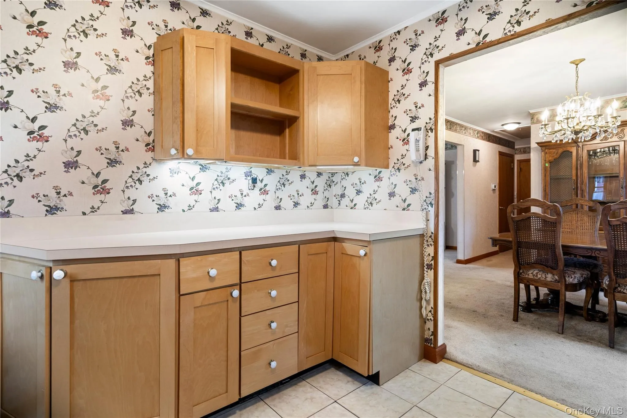 The kitchen has additional wood cabinets with formica counters for extra storage and prep space. The kitchen has additional wood cabinets with formica counters for extra storage and prep space.