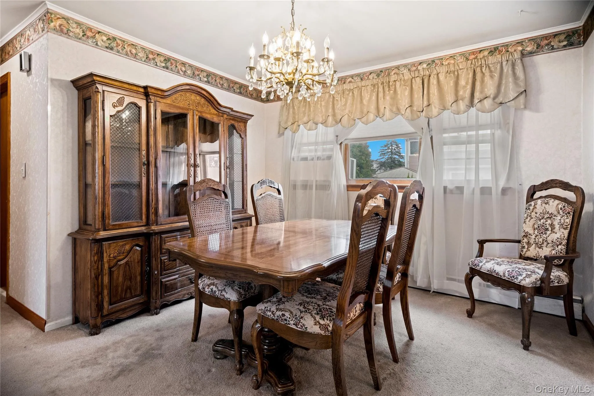Both the dining room & living room are carpeted, but hardwood floors exist under the carpeting throughout the entire main floor. Both the dining room & living room are carpeted, but hardwood floors exist under the carpeting throughout the entire main floor.