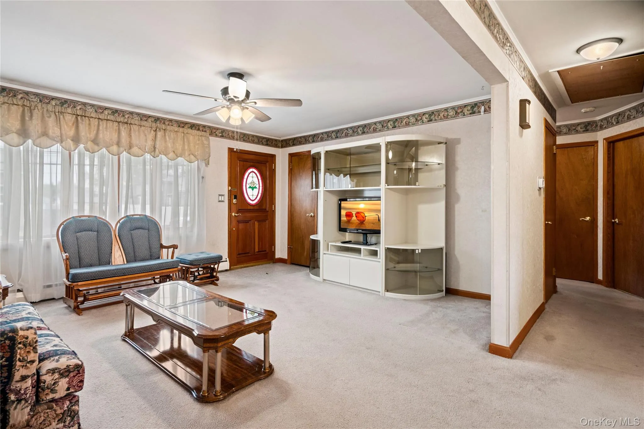 Off the living room & dining room is the hallway leading to the bathroom, bedrooms & the basement stairs. Off the living room & dining room is the hallway leading to the bathroom, bedrooms & the basement stairs.