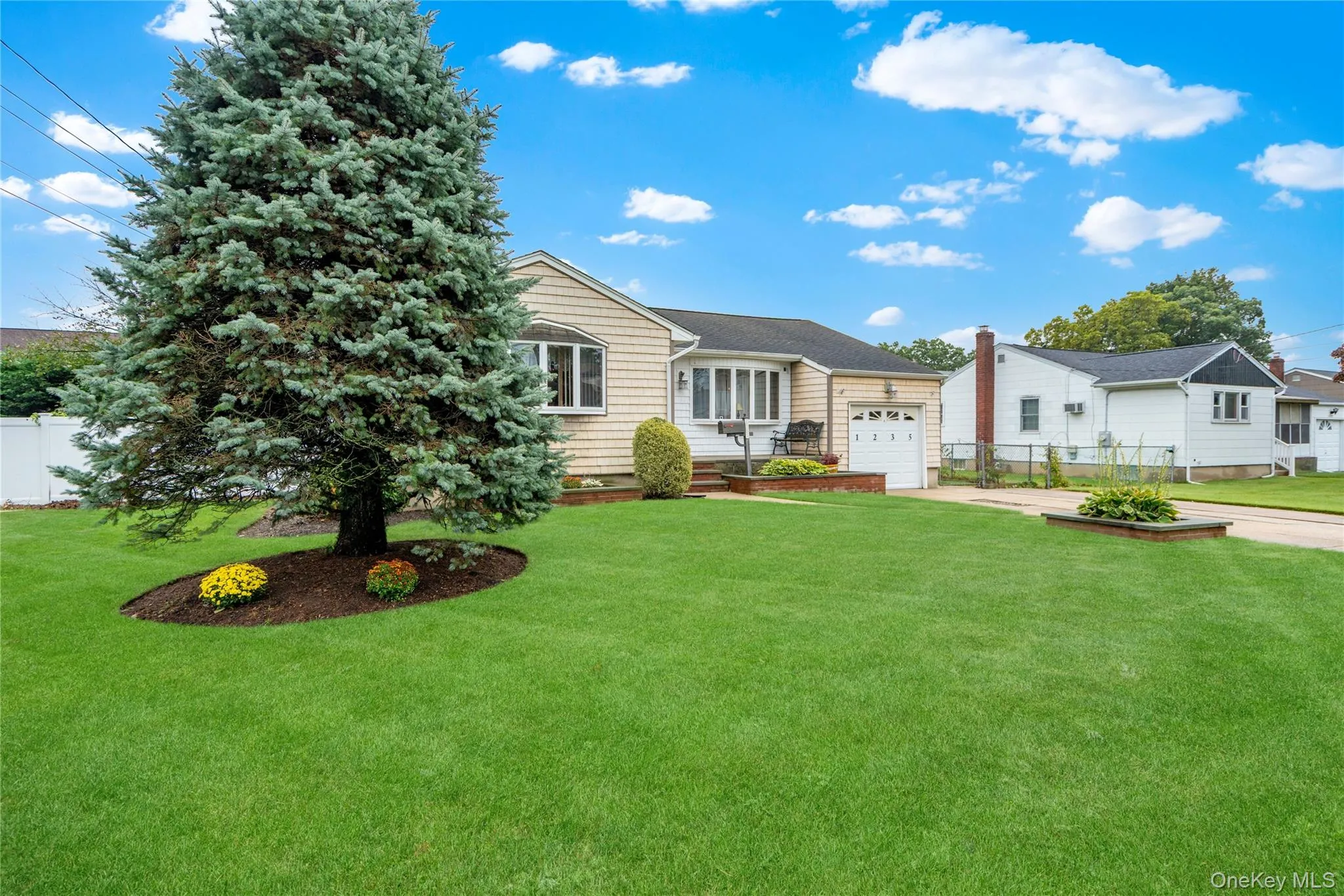 ...and the front of the home has vinyl shake siding (approx. 20 yrs) and mature landscaping with in-ground sprinklers. ...and the front of the home has vinyl shake siding (approx. 20 yrs) and mature landscaping with in-ground sprinklers.