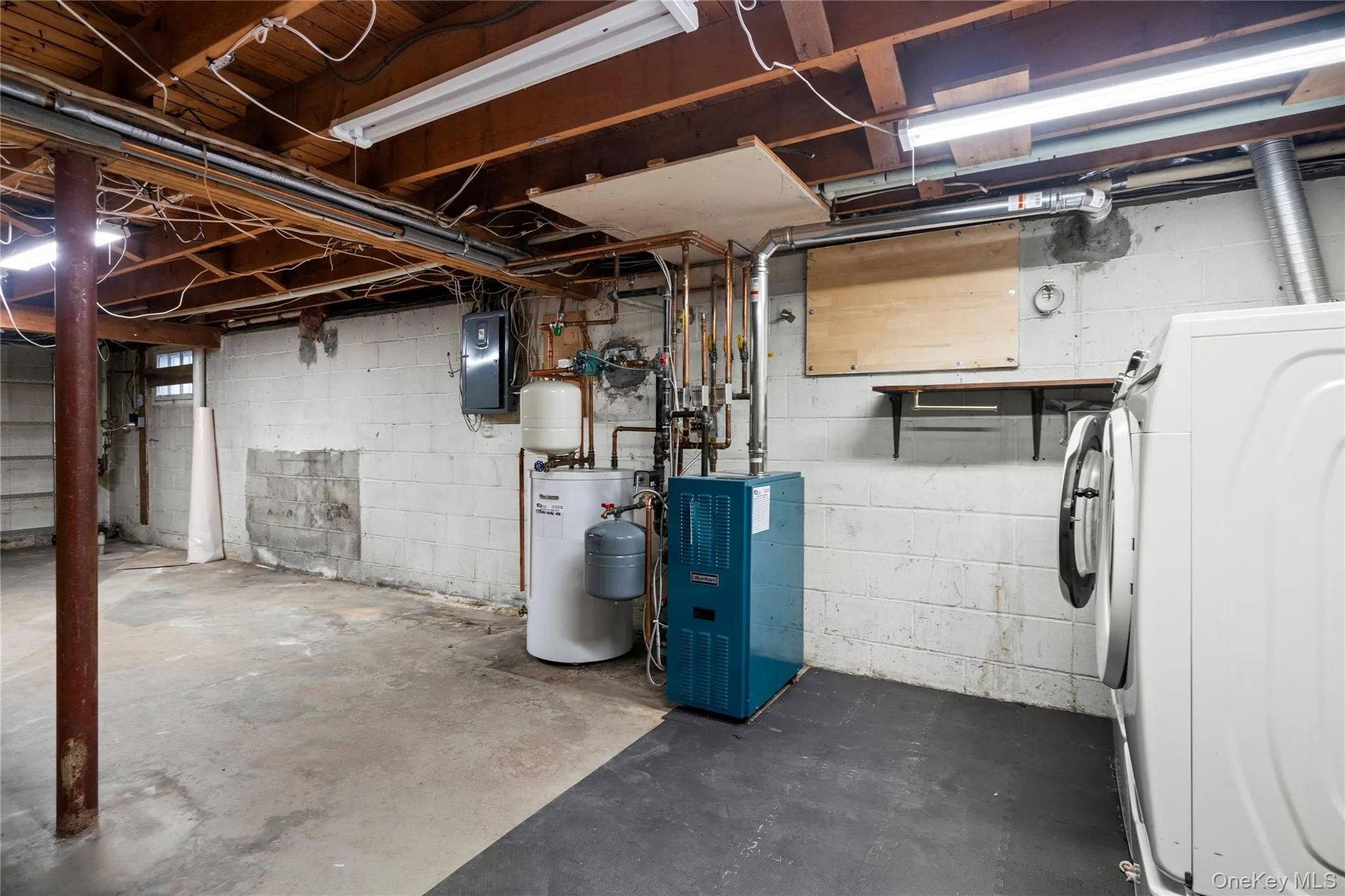 This area also houses the Burnham gas boiler & a Buderus 30 gallon hot water tank. This area also houses the Burnham gas boiler & a Buderus 30 gallon hot water tank.