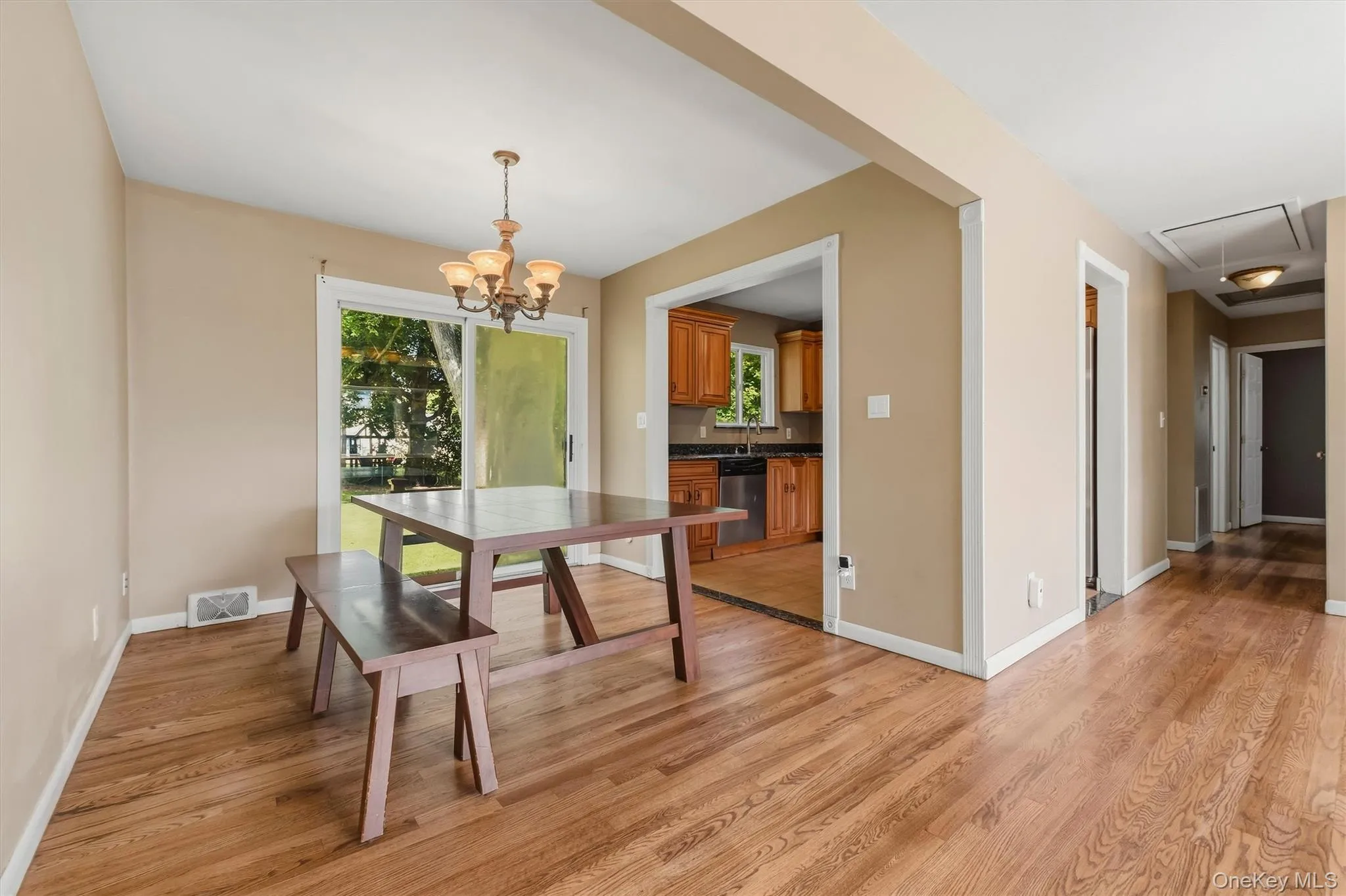 Formal dining room with sliding glass door to patio and yard. Formal dining room with sliding glass door to patio and yard.
